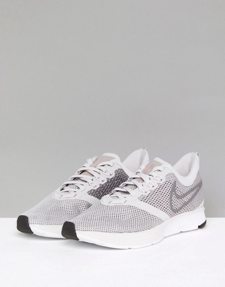nike running air zoom strike trainers in grey