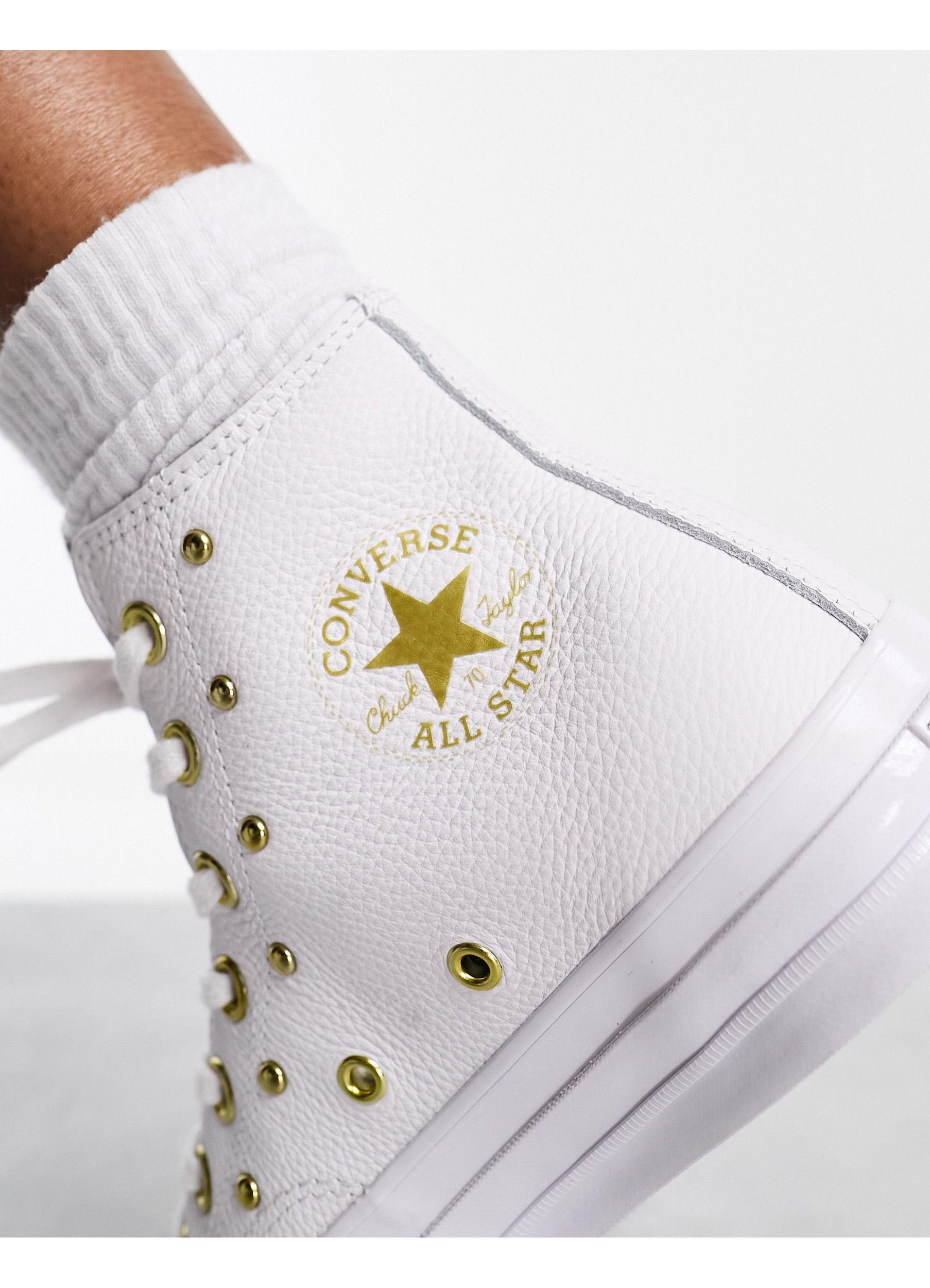 white converse with gold studs