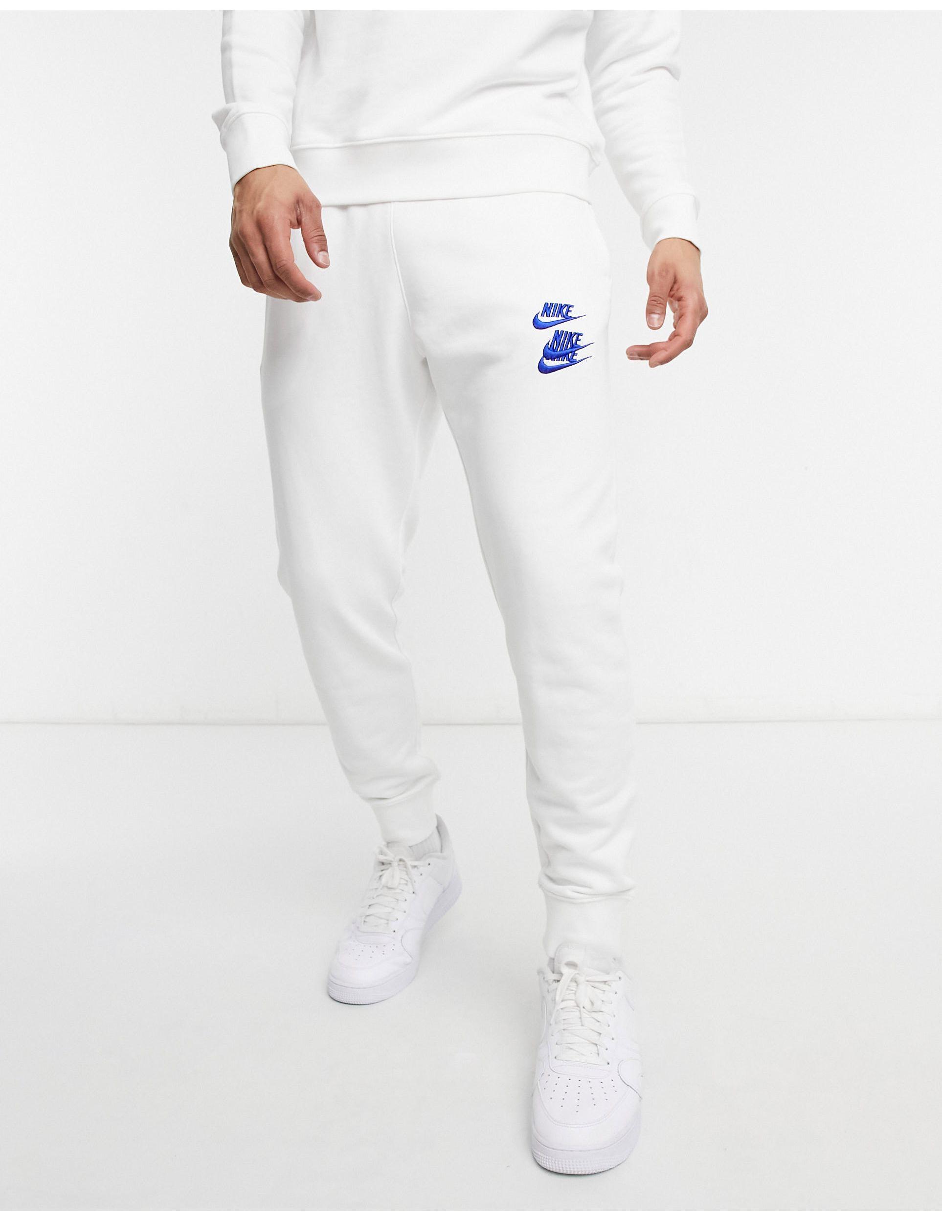 Nike World Tour Pack Graphic Cuffed joggers in White for Men Lyst UK