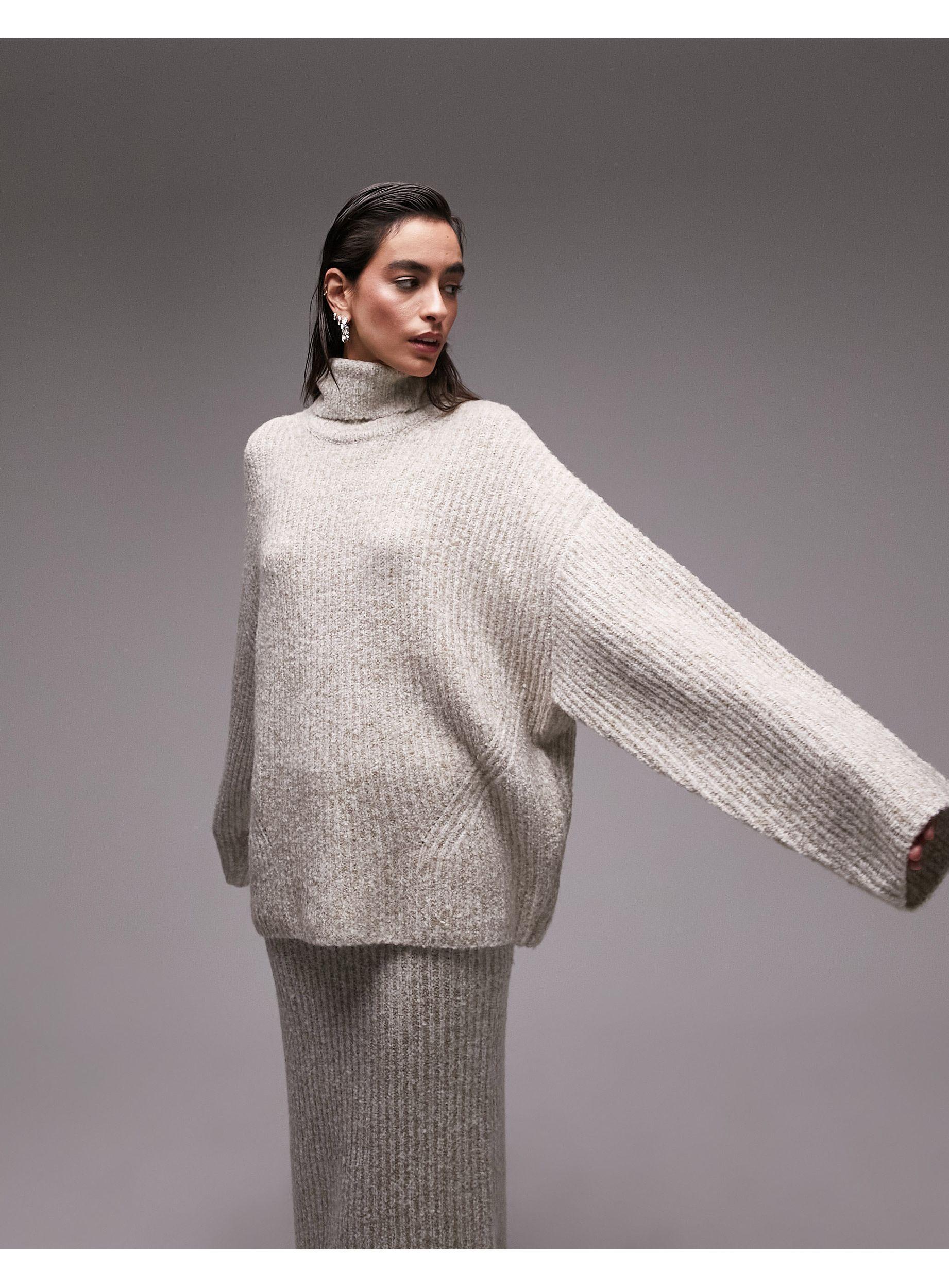 Grey knitted roll store neck jumper