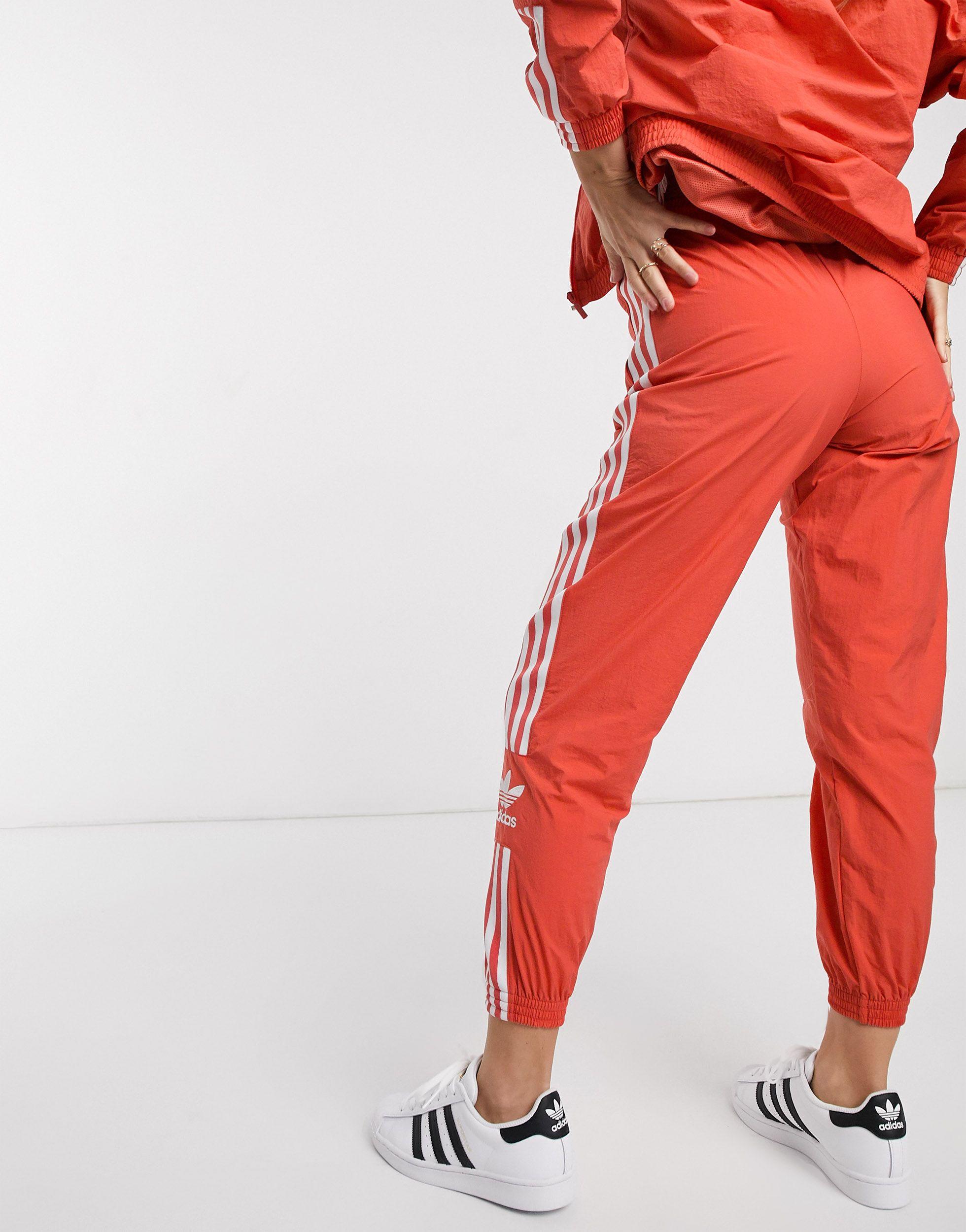 adidas Originals Synthetic Adicolor Locked Up Logo Track Pants in Red