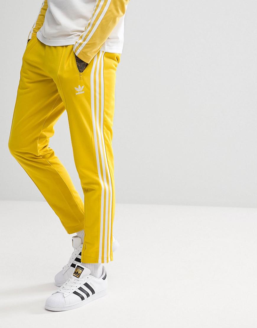 yellow adidas trousers