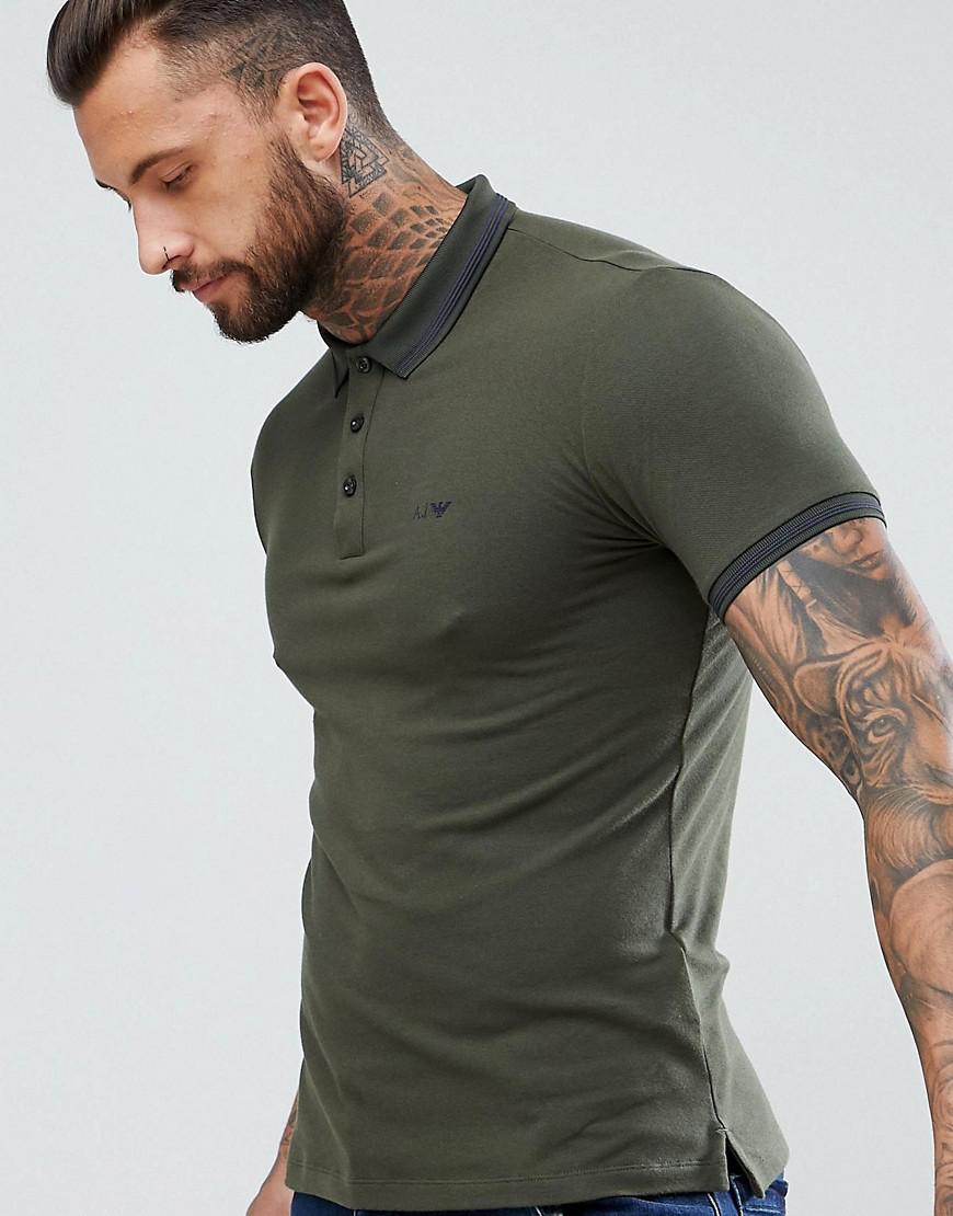 dark green shirt and jeans