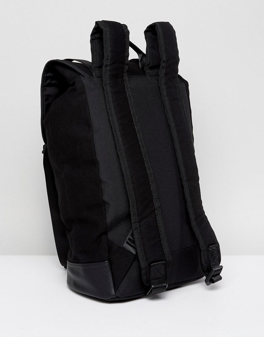 ASOS DESIGN canvas backpack with faux leather base in black