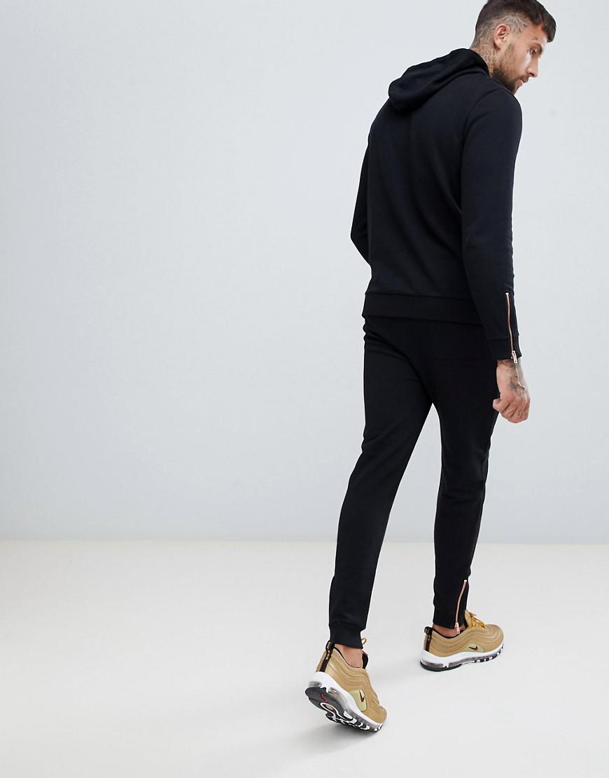 black and rose gold tracksuit