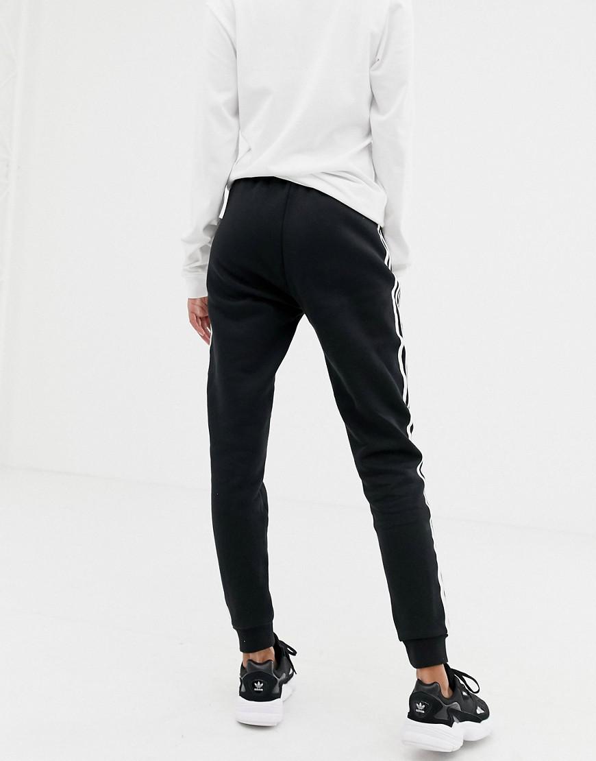 adidas Originals Cotton Three Stripe Cuffed Sweat Pants In adidas Originals Three Stripe Cuffed Sweat Pants In Black in