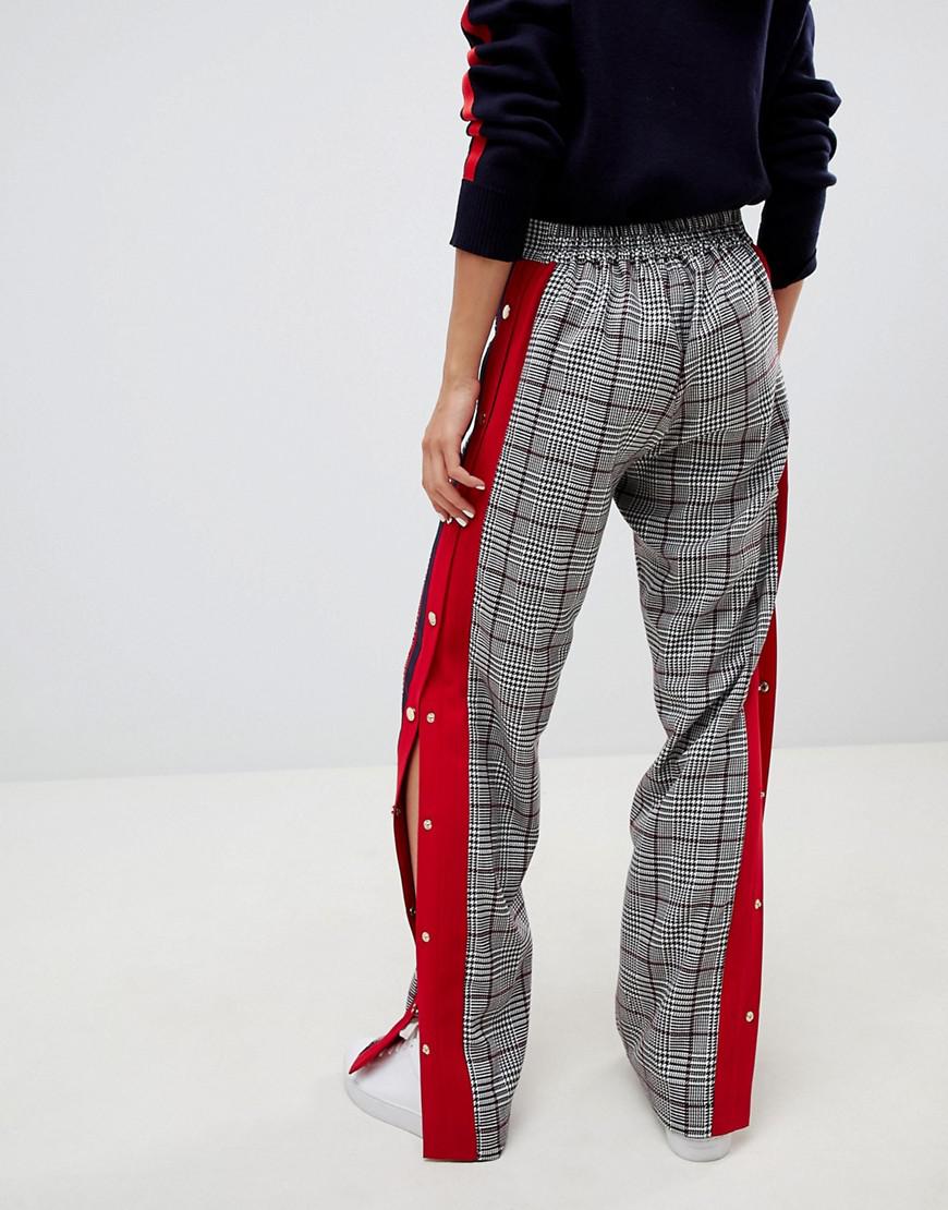 adidas originals mixed stripe popper pants in black and white