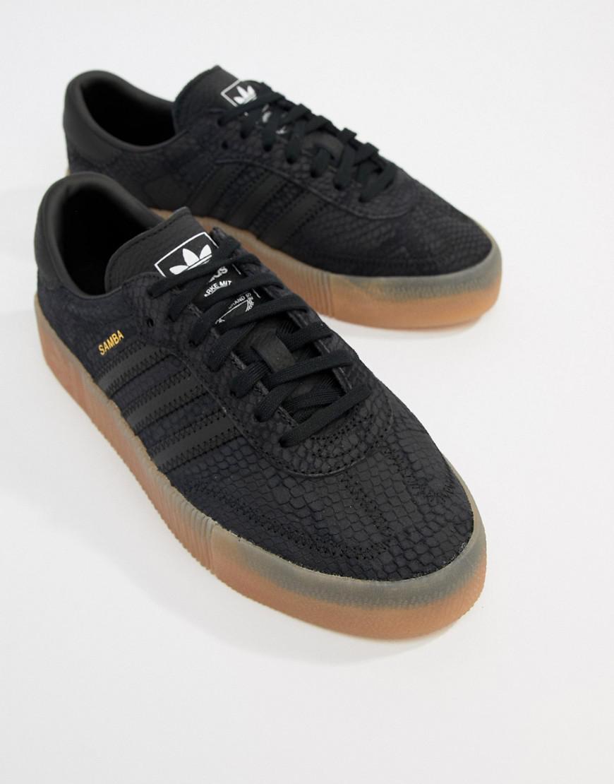 black adidas trainers brown sole