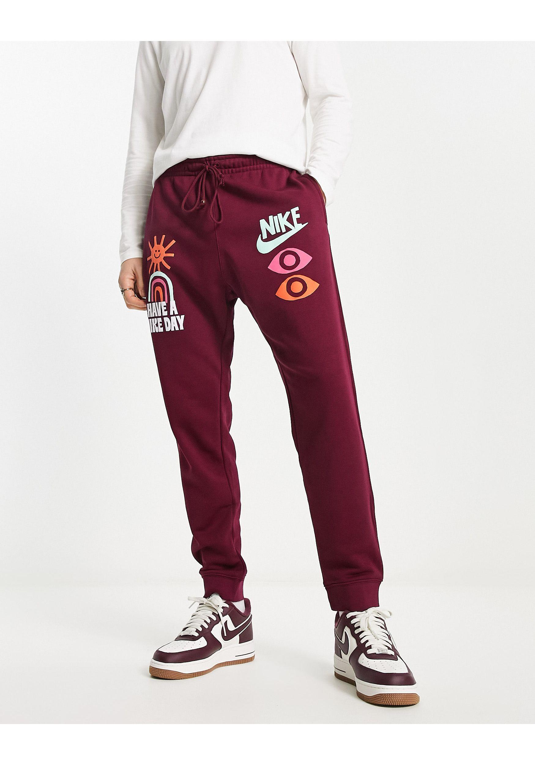 nike logo all over sweatpants