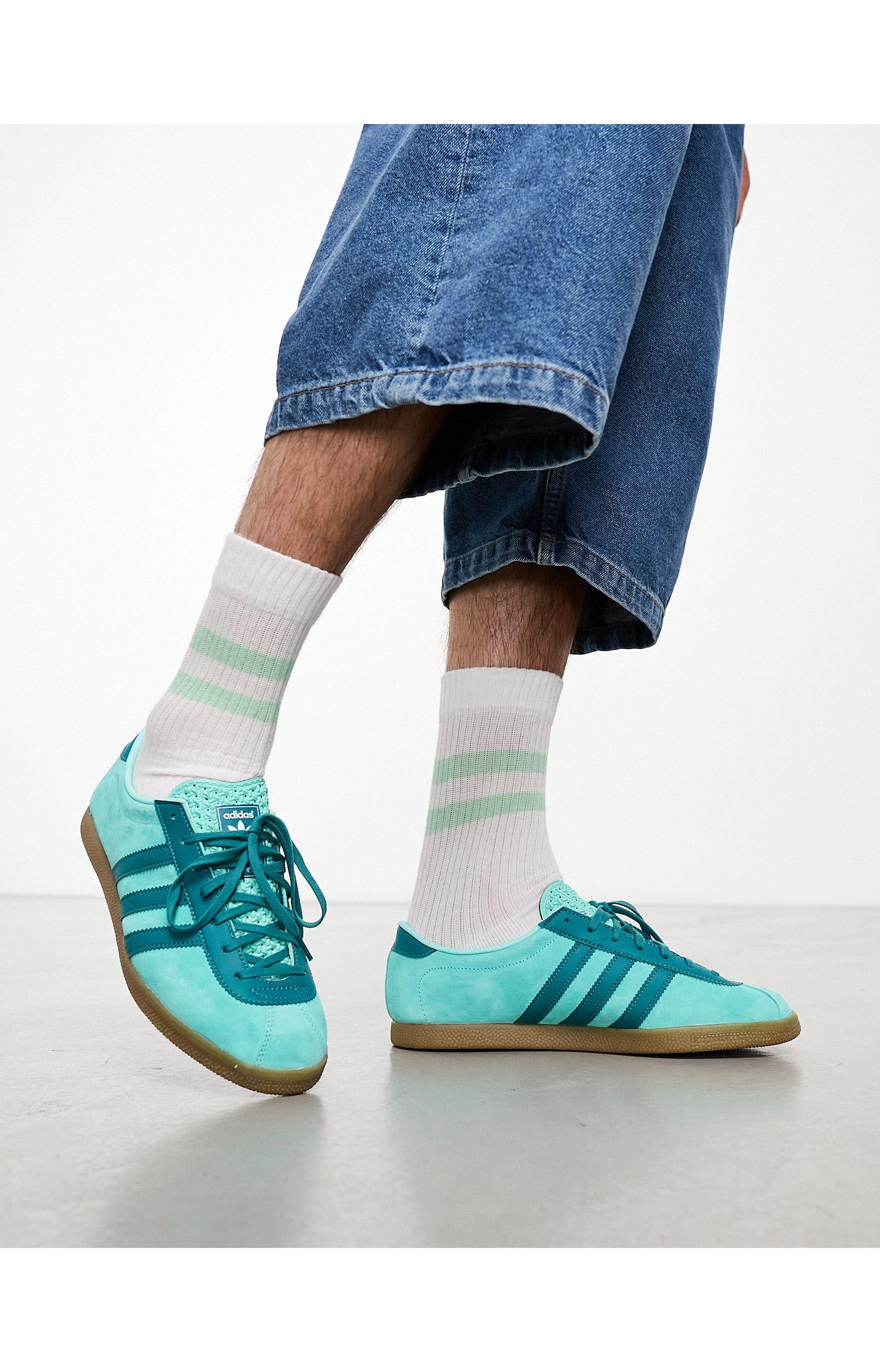 Blue adidas with gum sole cheap