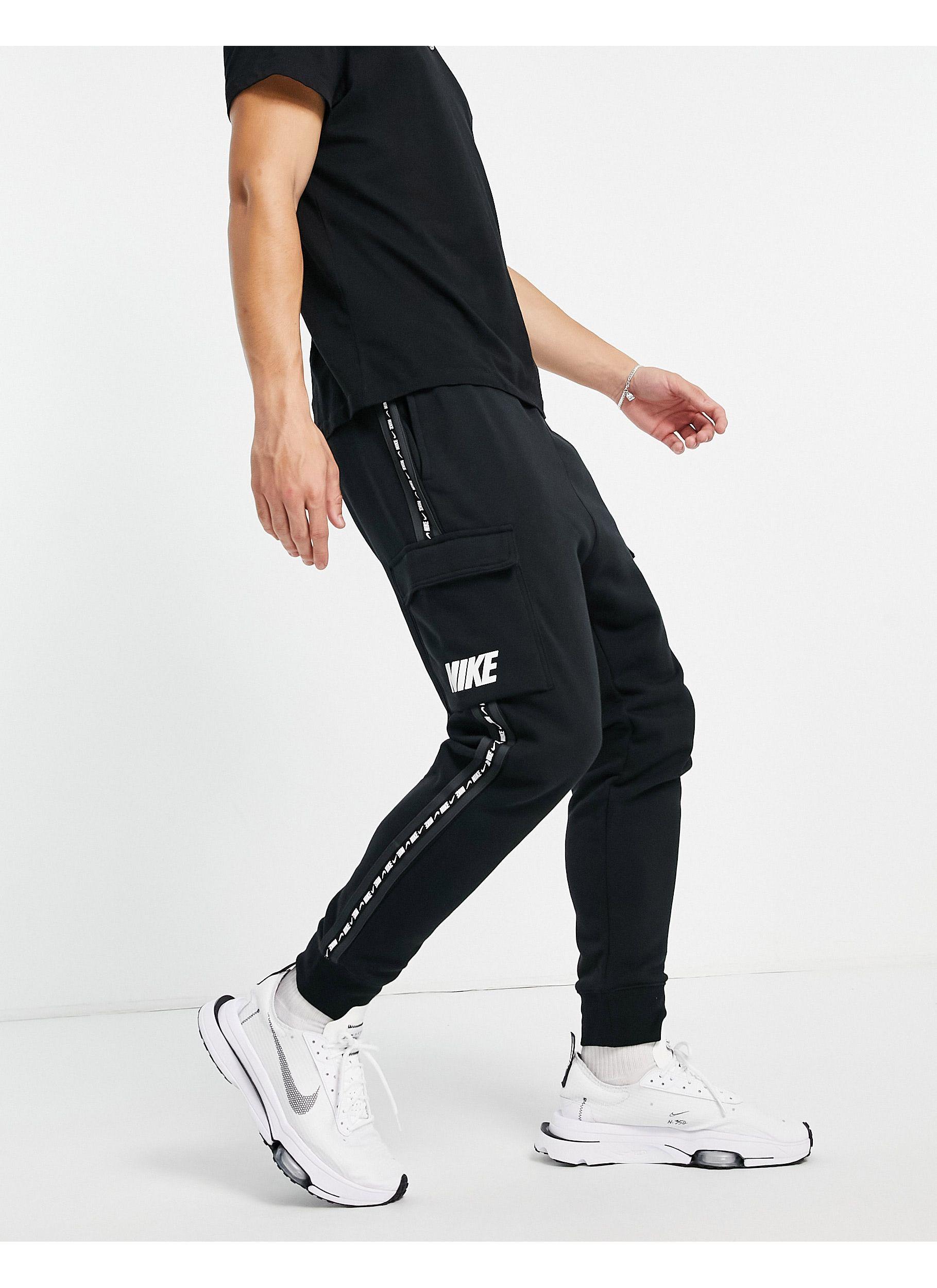 nike jogger en polaire à logo virgule noir