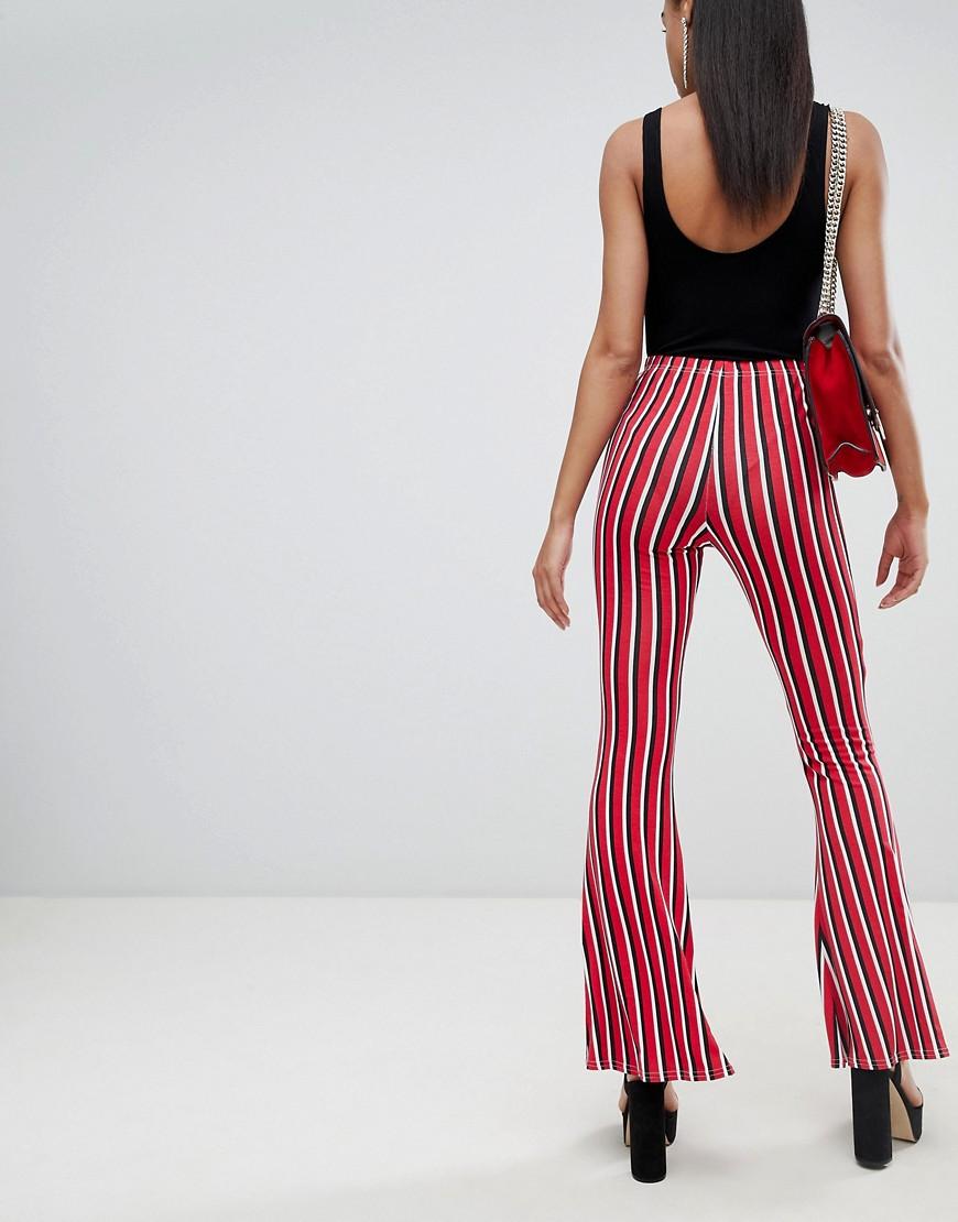 Pantaloni a zampa a righe di PrettyLittleThing in Rosso | Lyst