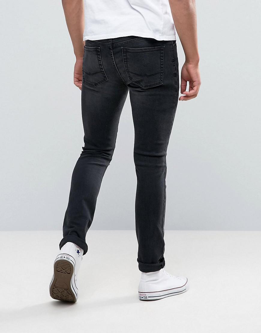 Lyst - Asos Super Skinny Jeans With Knee Rips In Dark Grey Wash in Gray ...