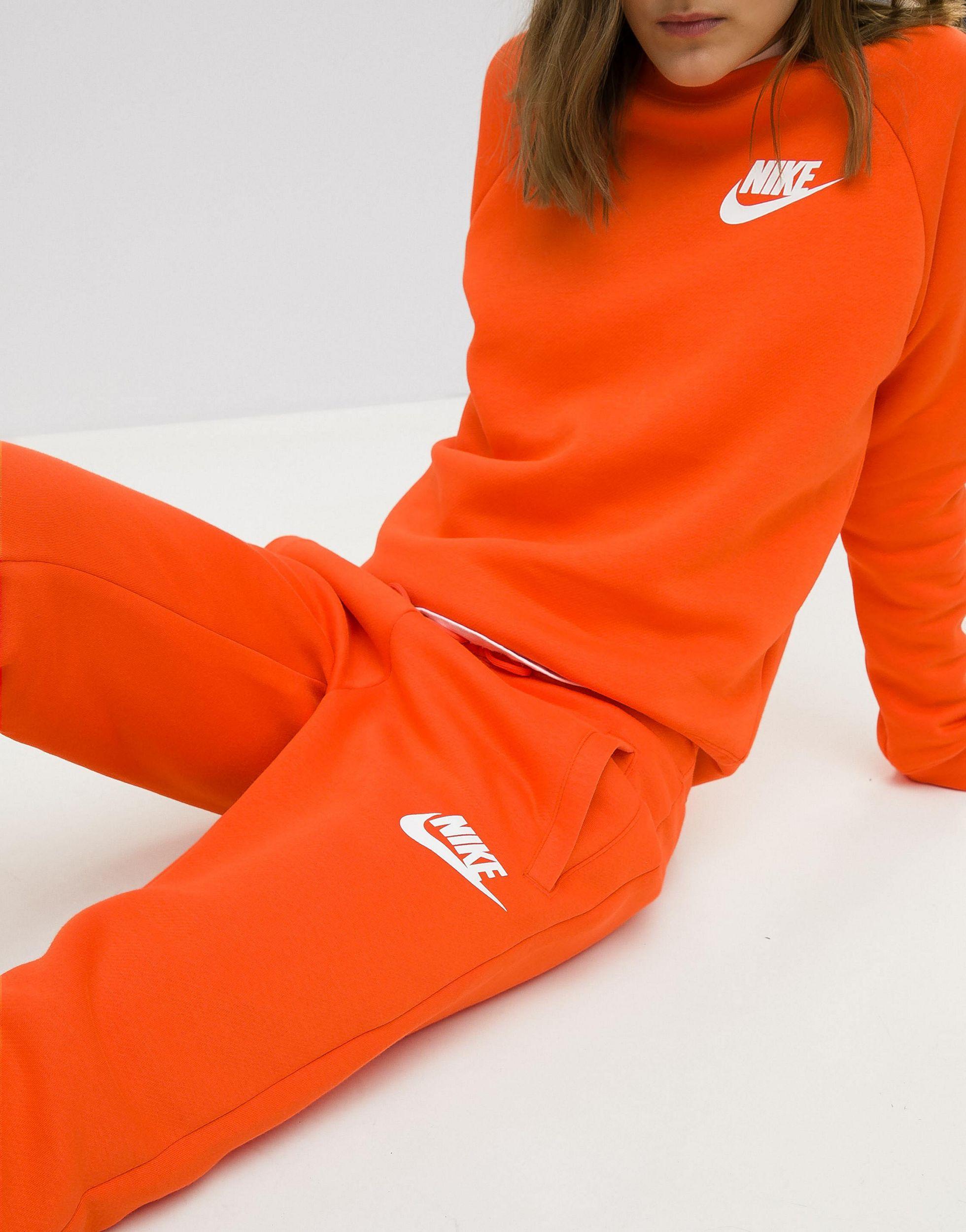 dividend build up Children's day Nike – Rally – Jogginghose in Orange | Lyst DE