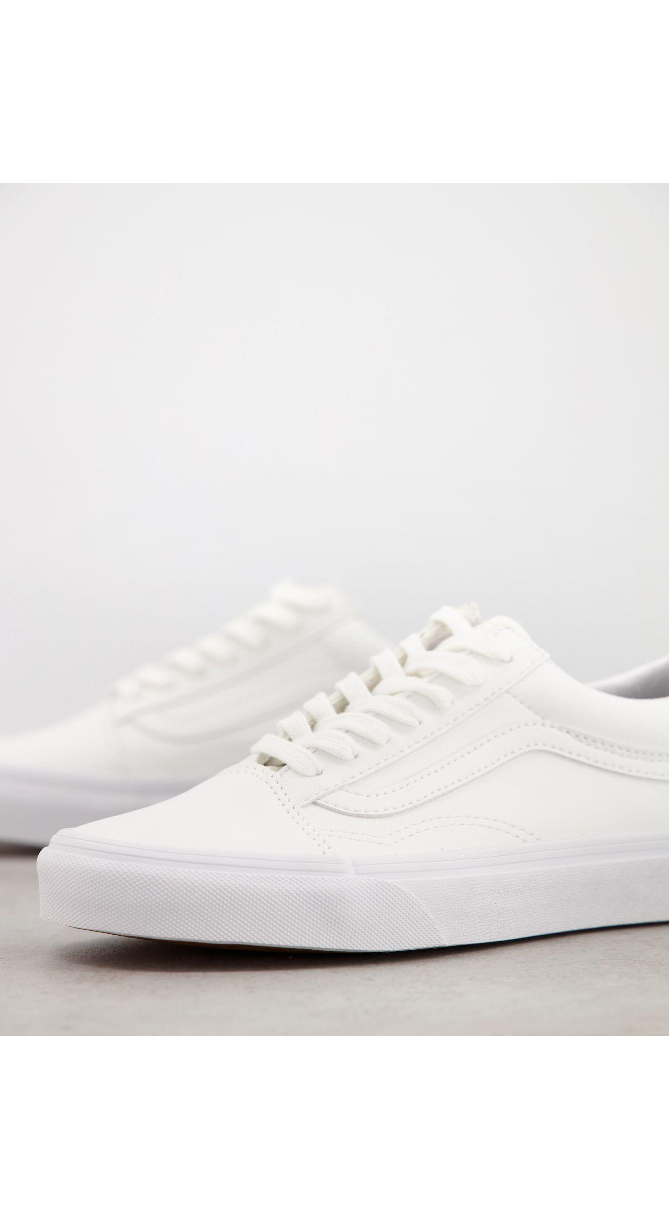 white faux leather vans
