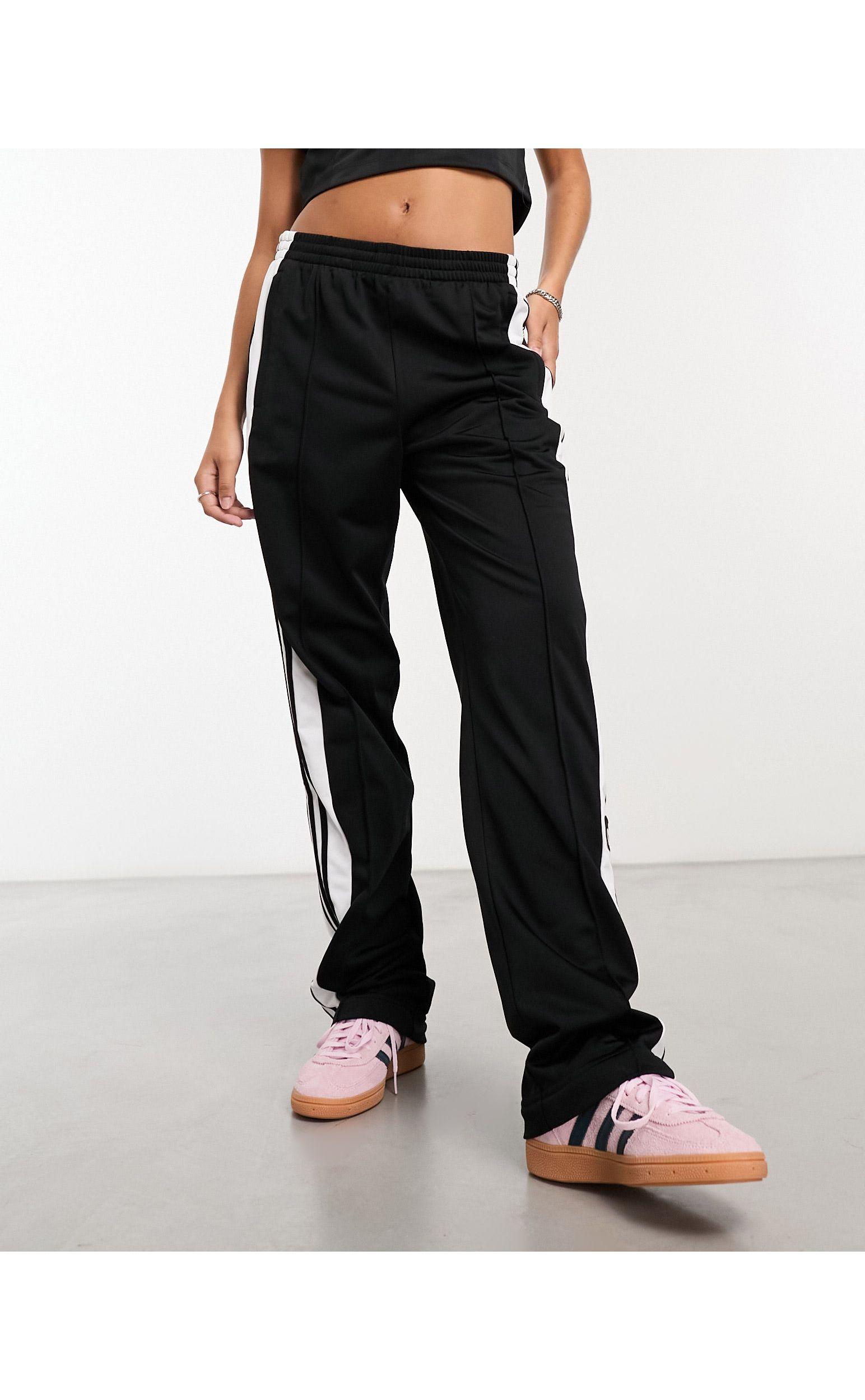 Adidas originals joggers hotsell with poppers black
