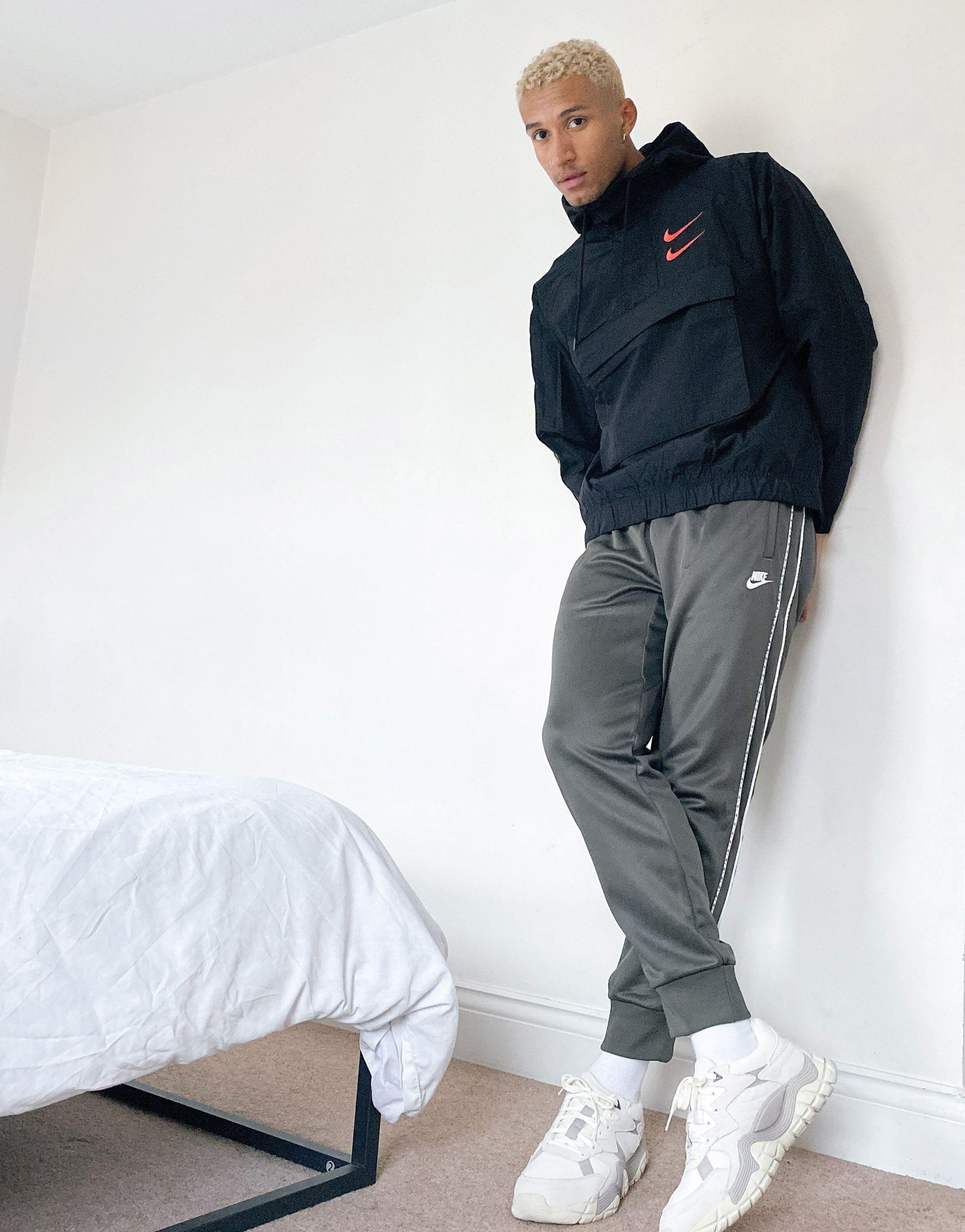 nike logo taping cuffed joggers in grey