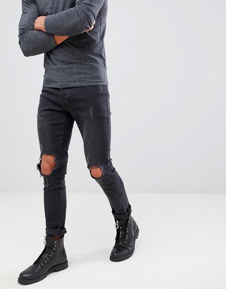 busted knee black jeans