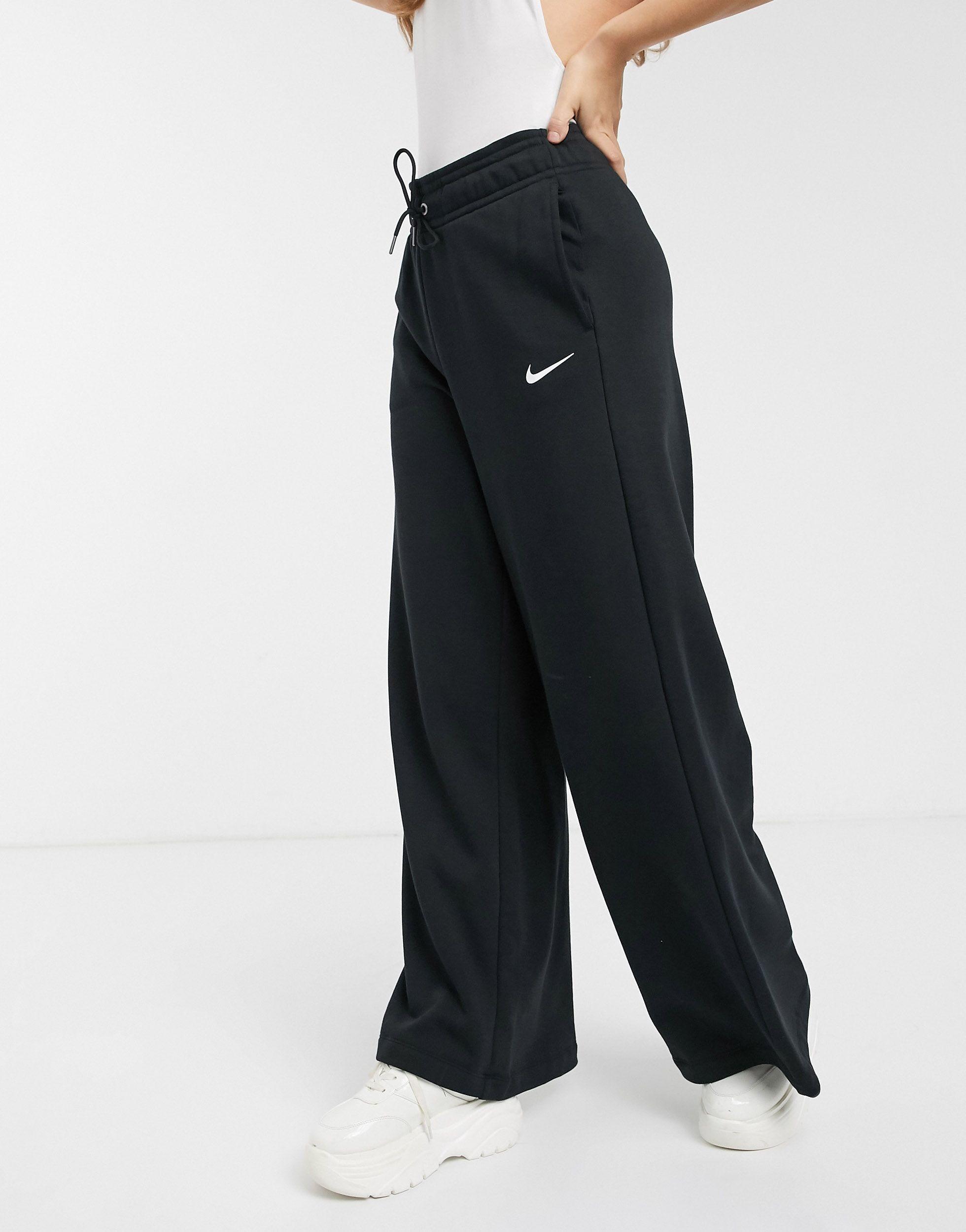 Higgins Serena bezelye  Nike Cotton Black Wide Leg High Waist joggers, Plain Pattern | Lyst