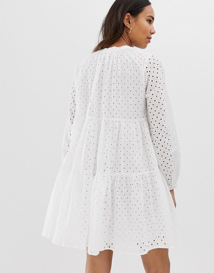 asos design petite tiered trapeze mini dress in broderie