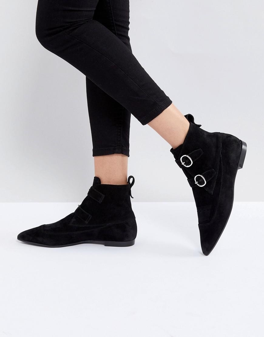 black pointed buckle boots