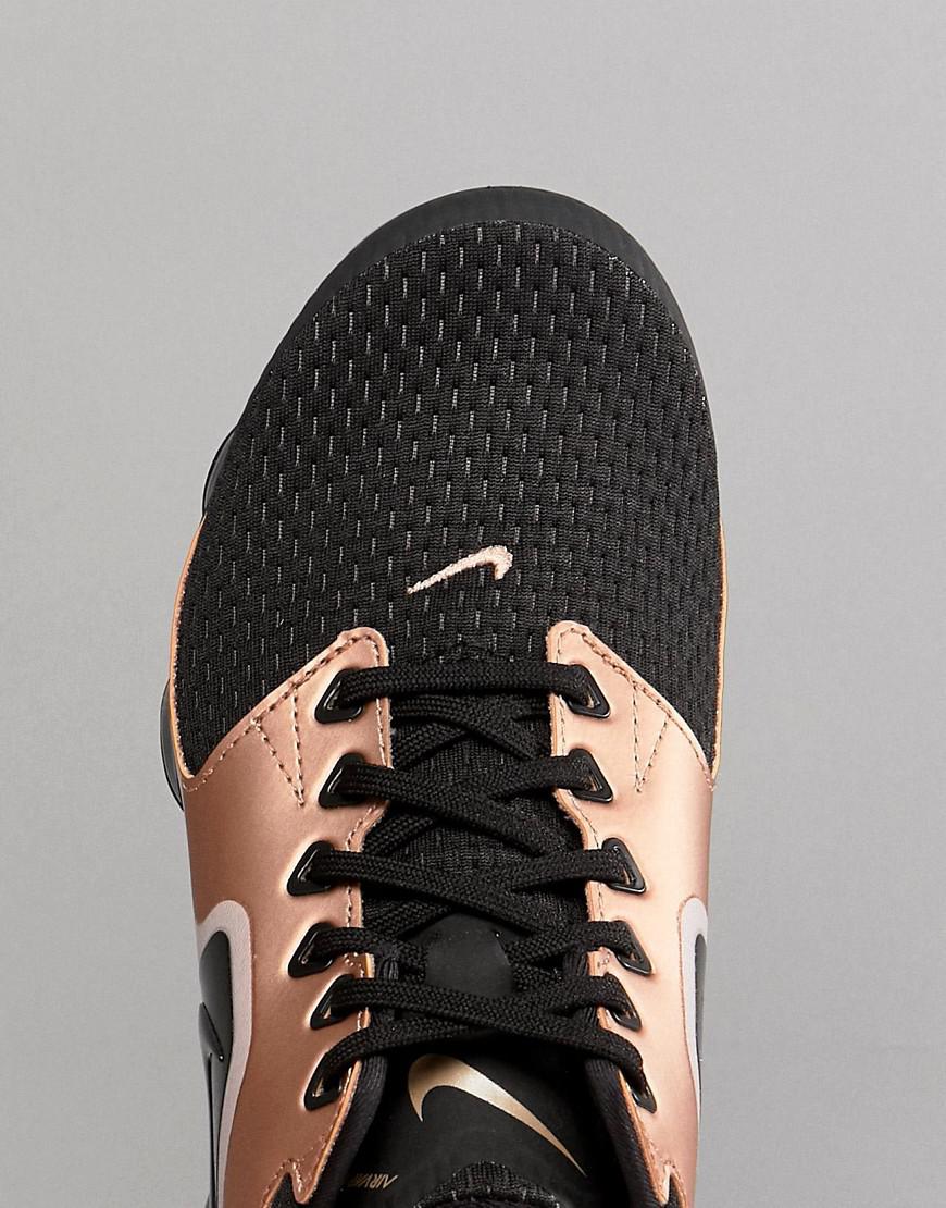 black and rose gold nike trainers
