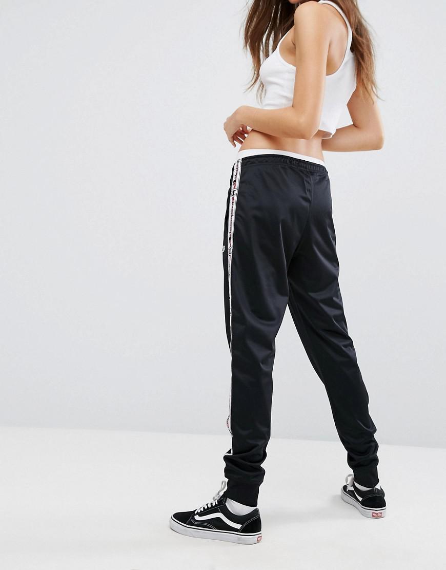 Champion tracksuit bottoms with logo taping Clearance