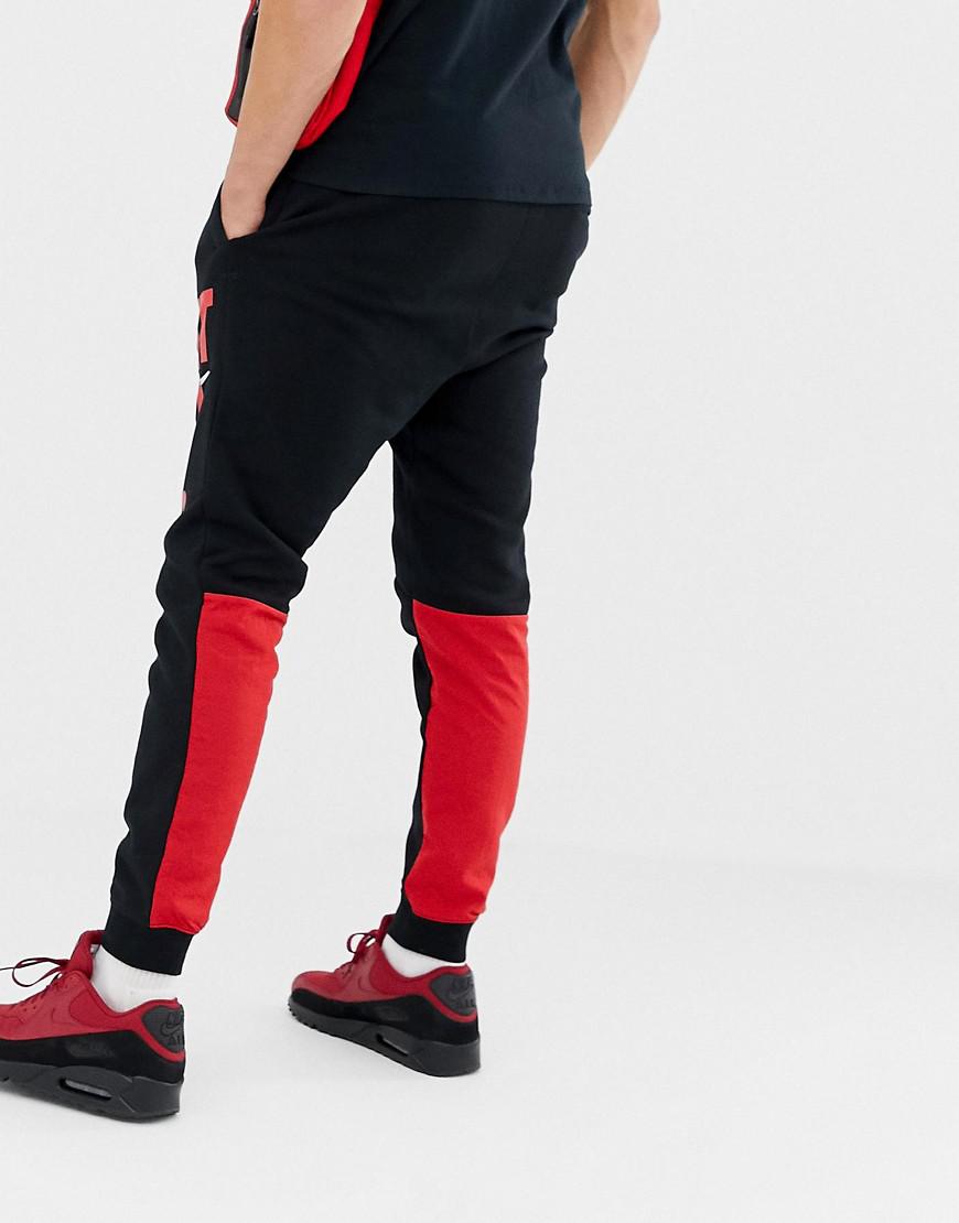 nike black and red joggers