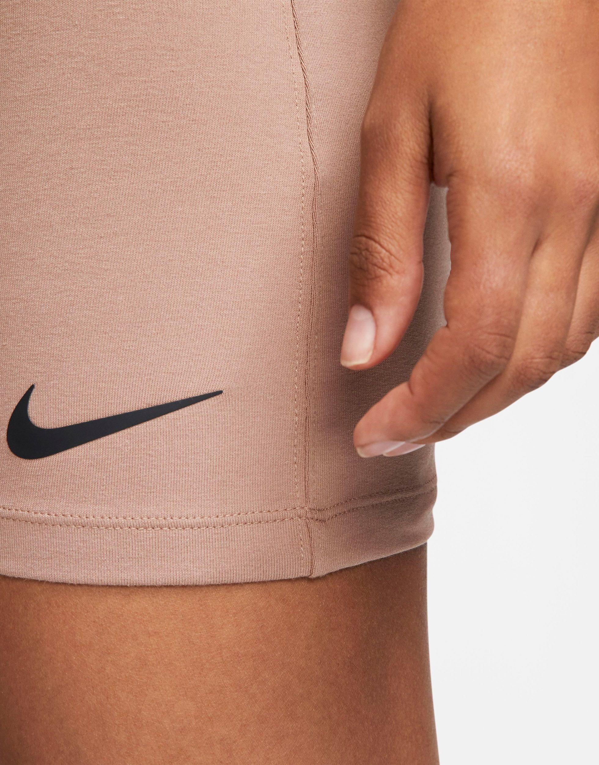 Nike – einteiler mit swoosh-logo in Natur | Lyst AT