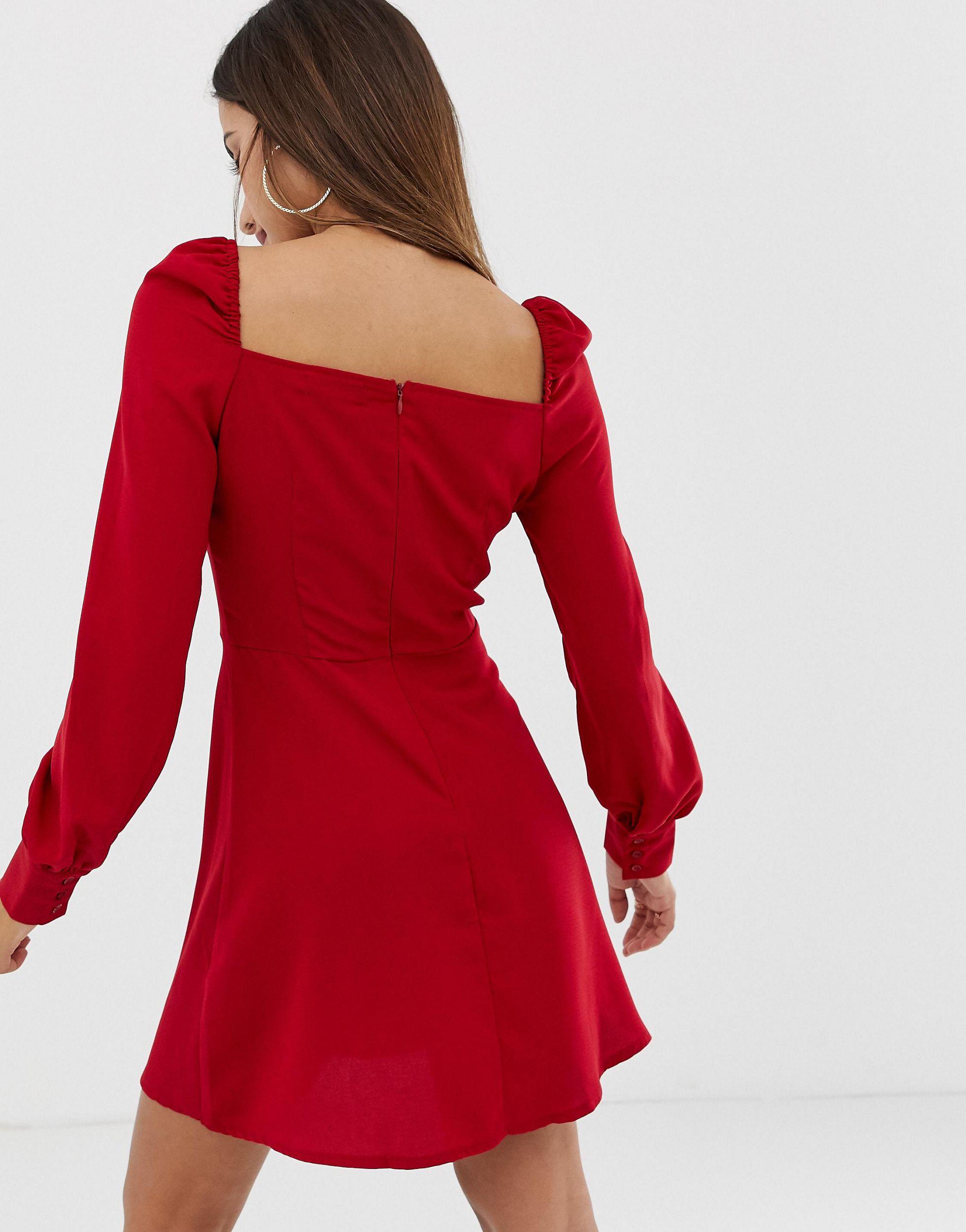 red skater dress with sweetheart neckline