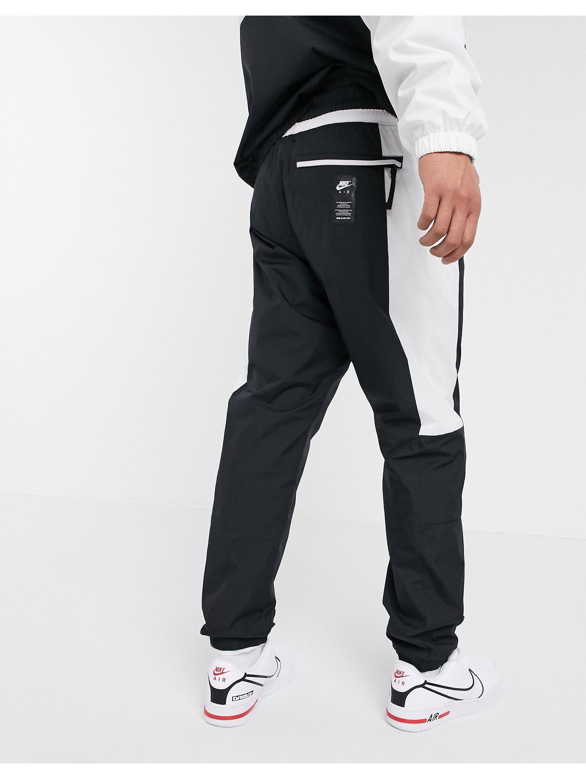 Nike Air Cuffed Woven joggers in Black for Men | Lyst