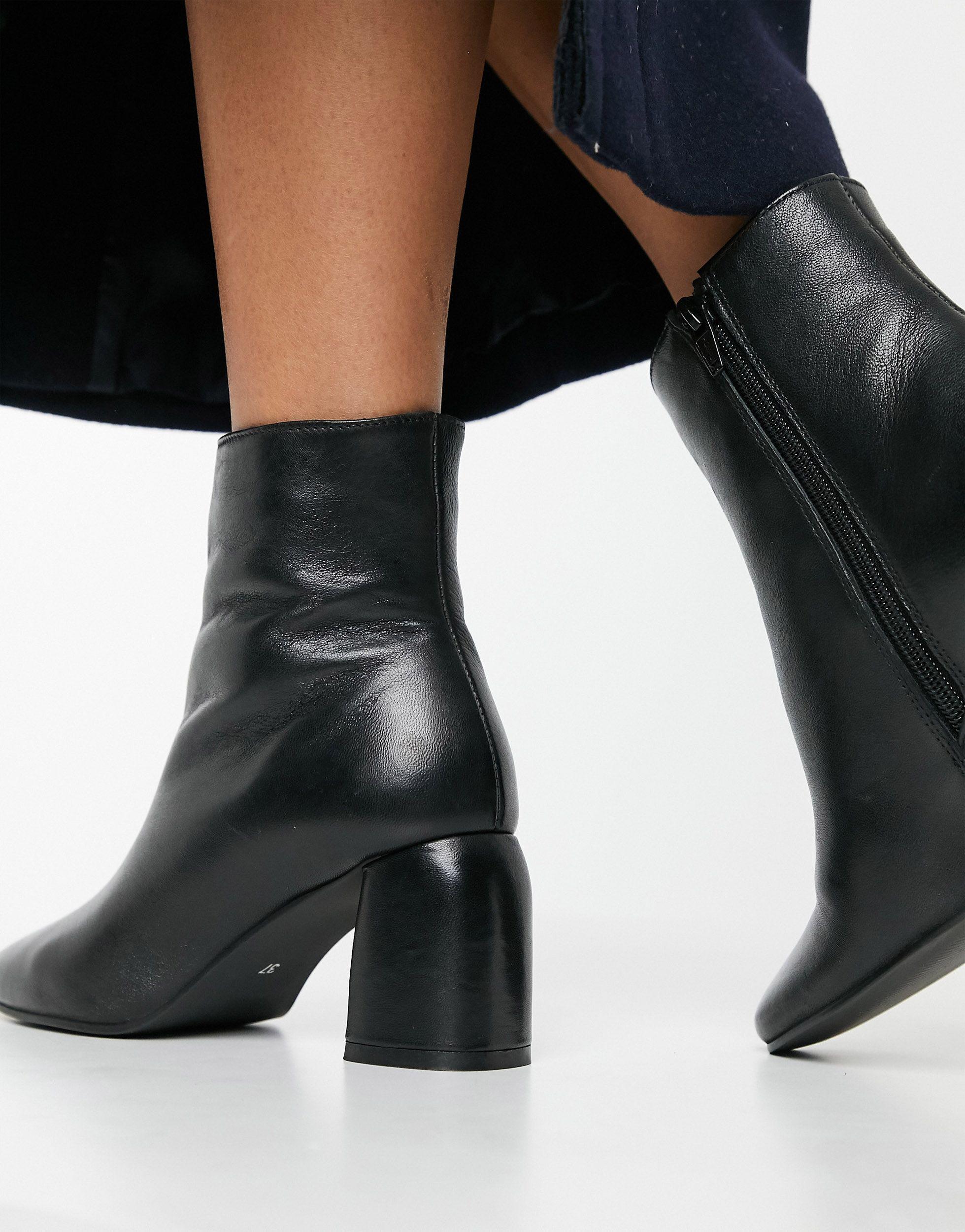 Zwarte leren kuitlaarzen met hoge blokhak en dikke plateauzool | Modemuze