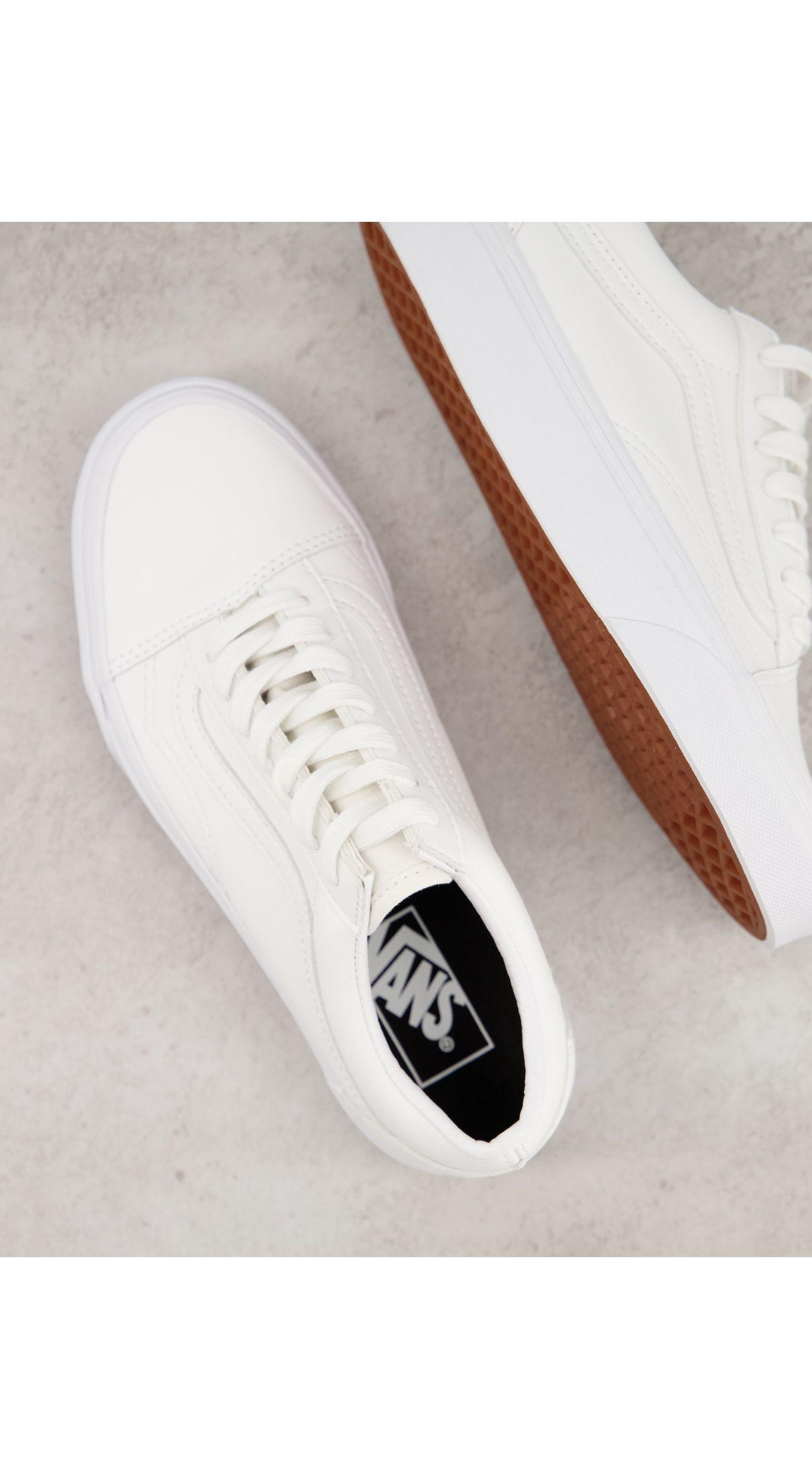 white faux leather vans