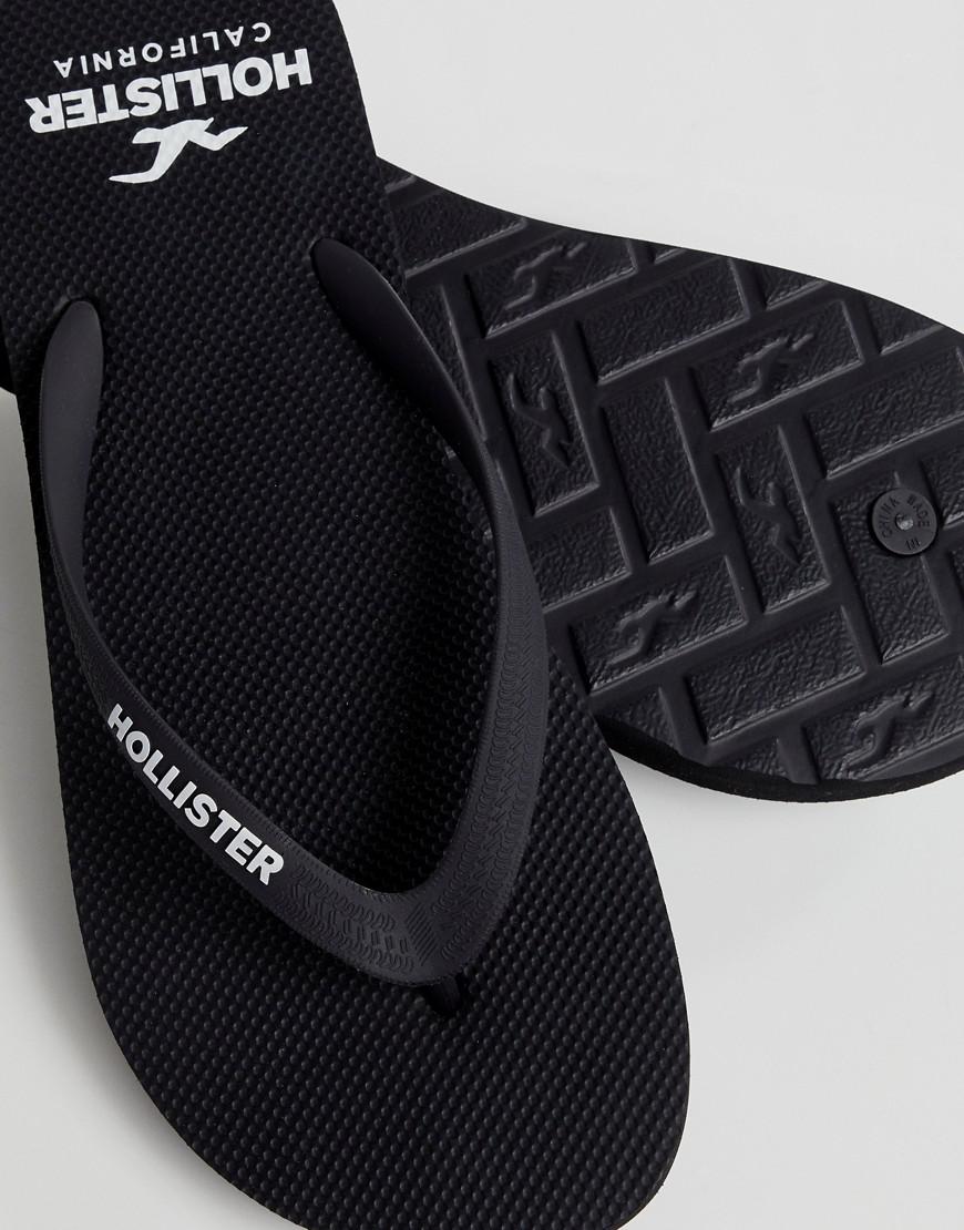 Hollister Solid Rubber Logo Flip Flop in Black for Men | Lyst
