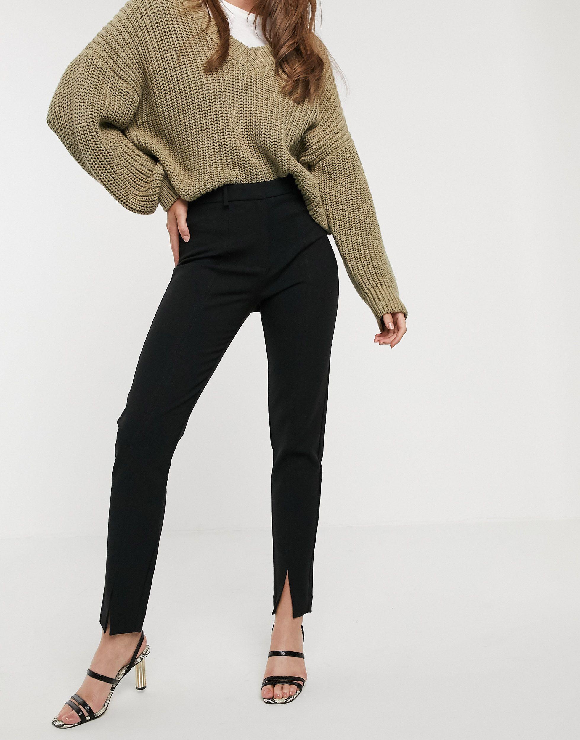 Pantaloni con spacco frontale neriMango in Materiale sintetico di colore  Nero | Lyst