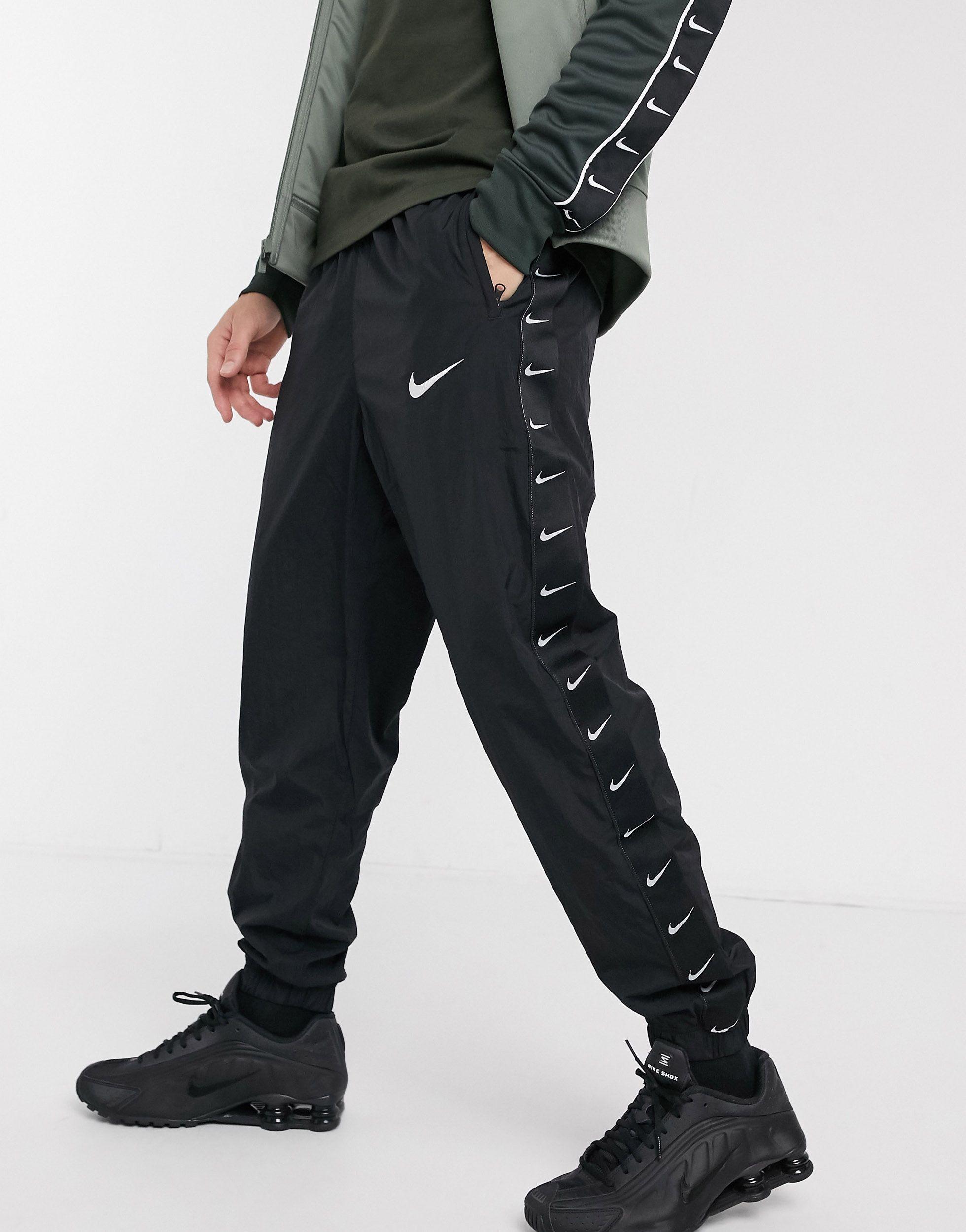 Nike Woven Taping Cuffed joggers in Black for Men | Lyst UK