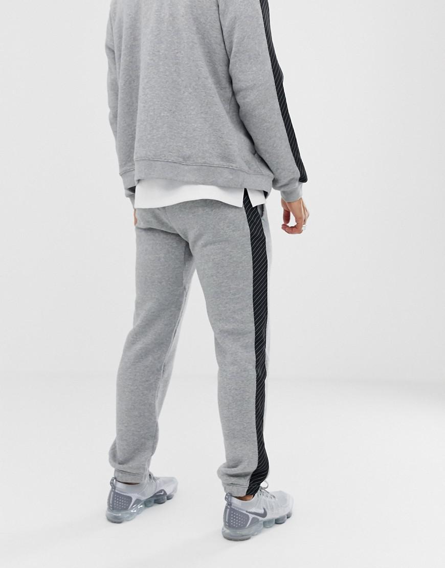 grey nike sweatpants black stripe Off 50% - sirinscrochet.com