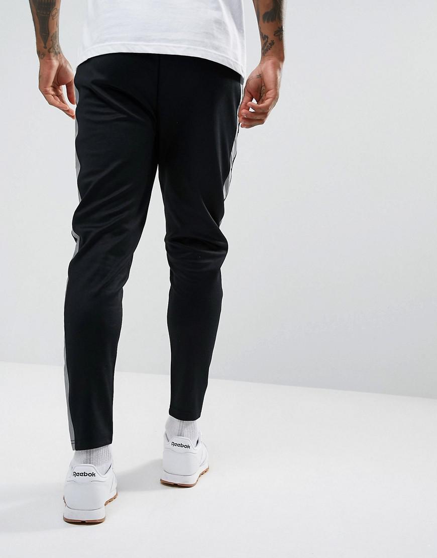 Ellesse Cotton Joggers With Reflective Panel in Black for Men - Lyst
