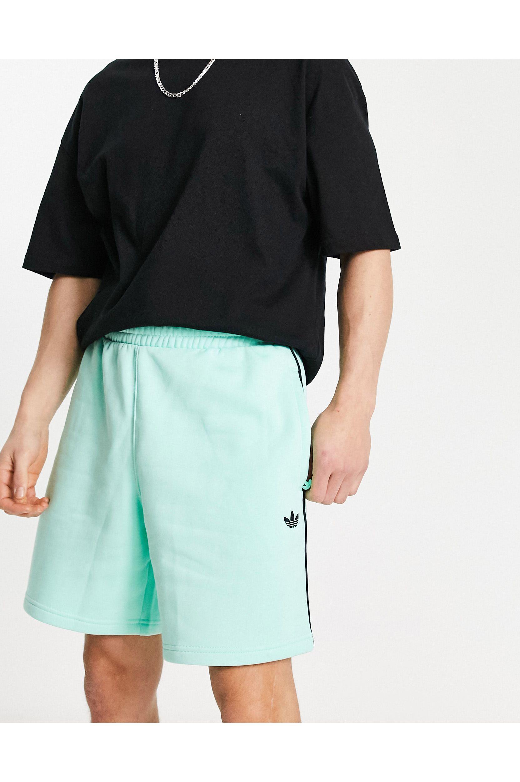 malo Erradicar Primitivo Pantalones cortos verdes con logo adicolor next adidas Originals de hombre  de color Blanco | Lyst