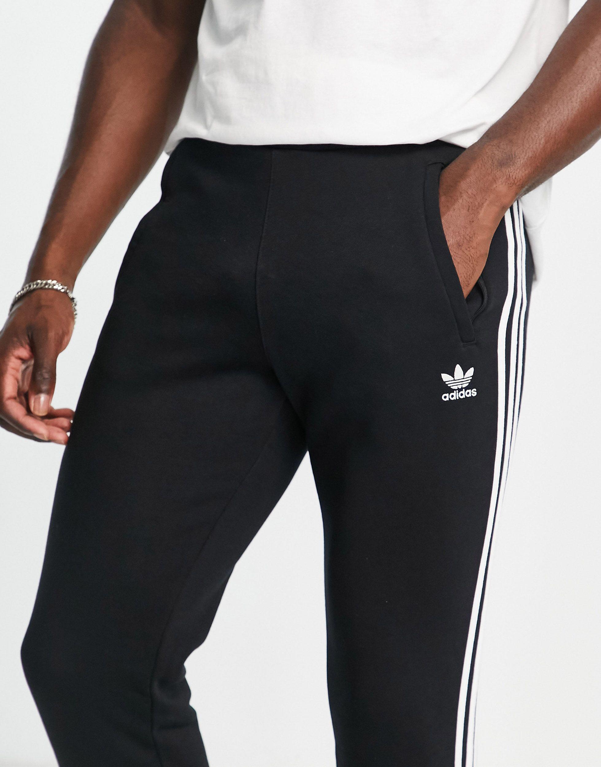 Adidas originals superstar 3 stripe skinny joggers in black sales