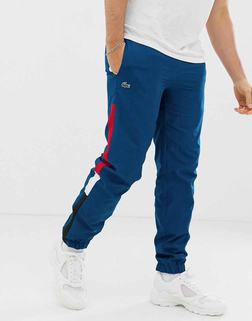 red lacoste tracksuit bottoms