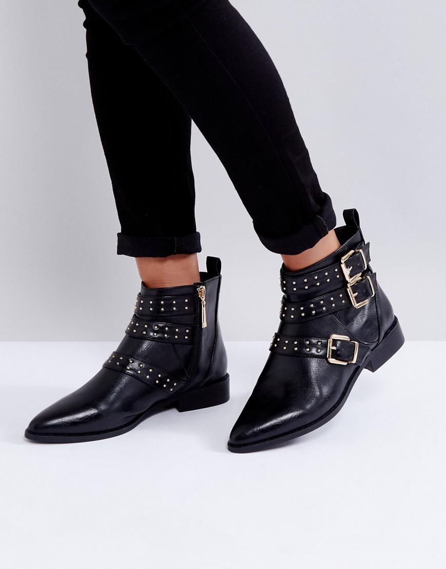 black flat buckle boots
