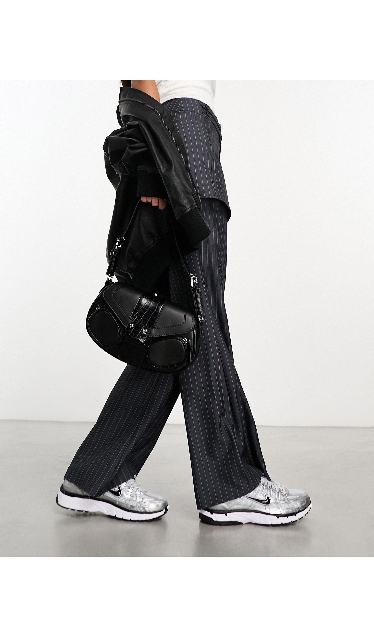 Pantaloni gessati con gonna sovrapposta e dettaglio di Reclaimed