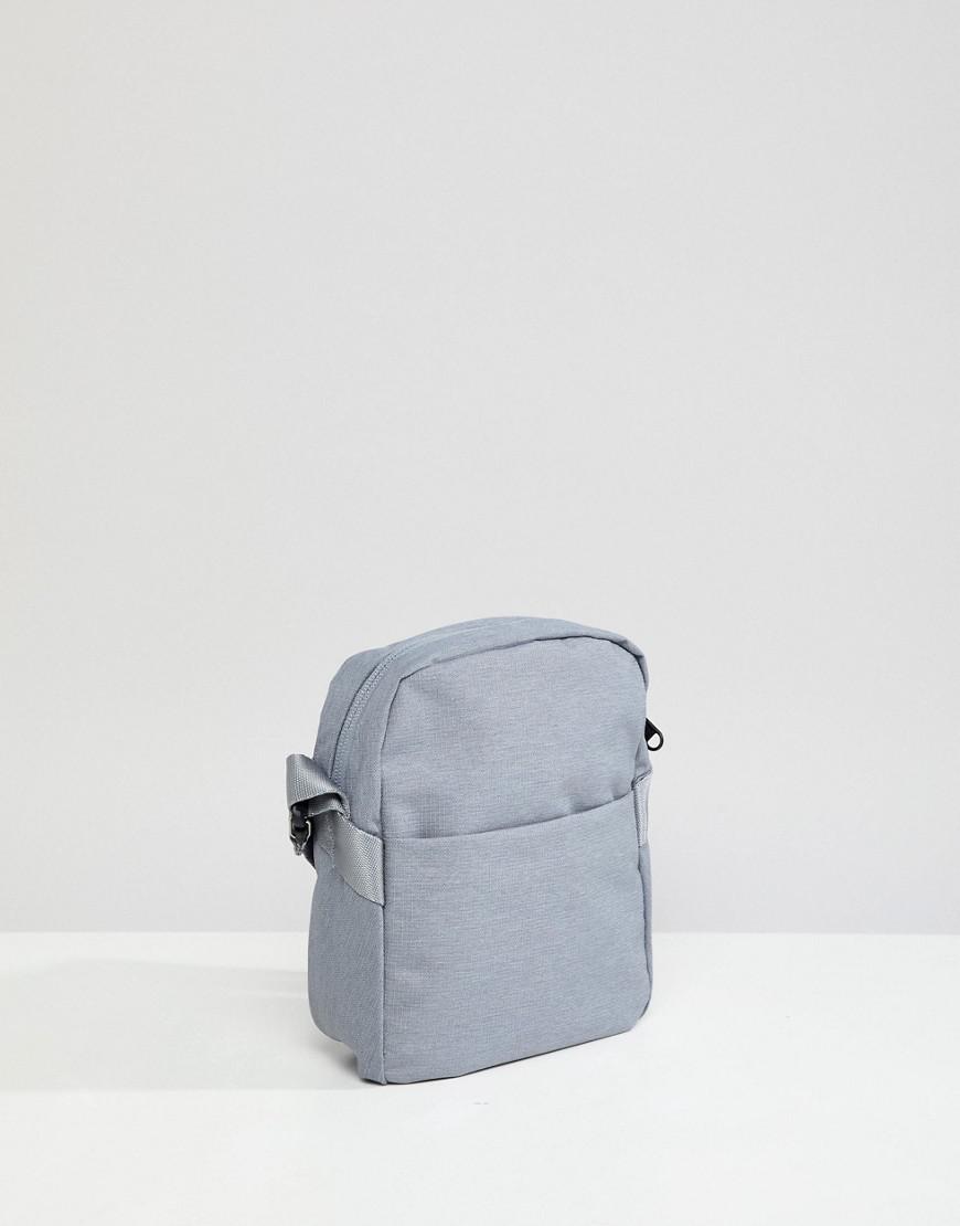 grey north face bolsa