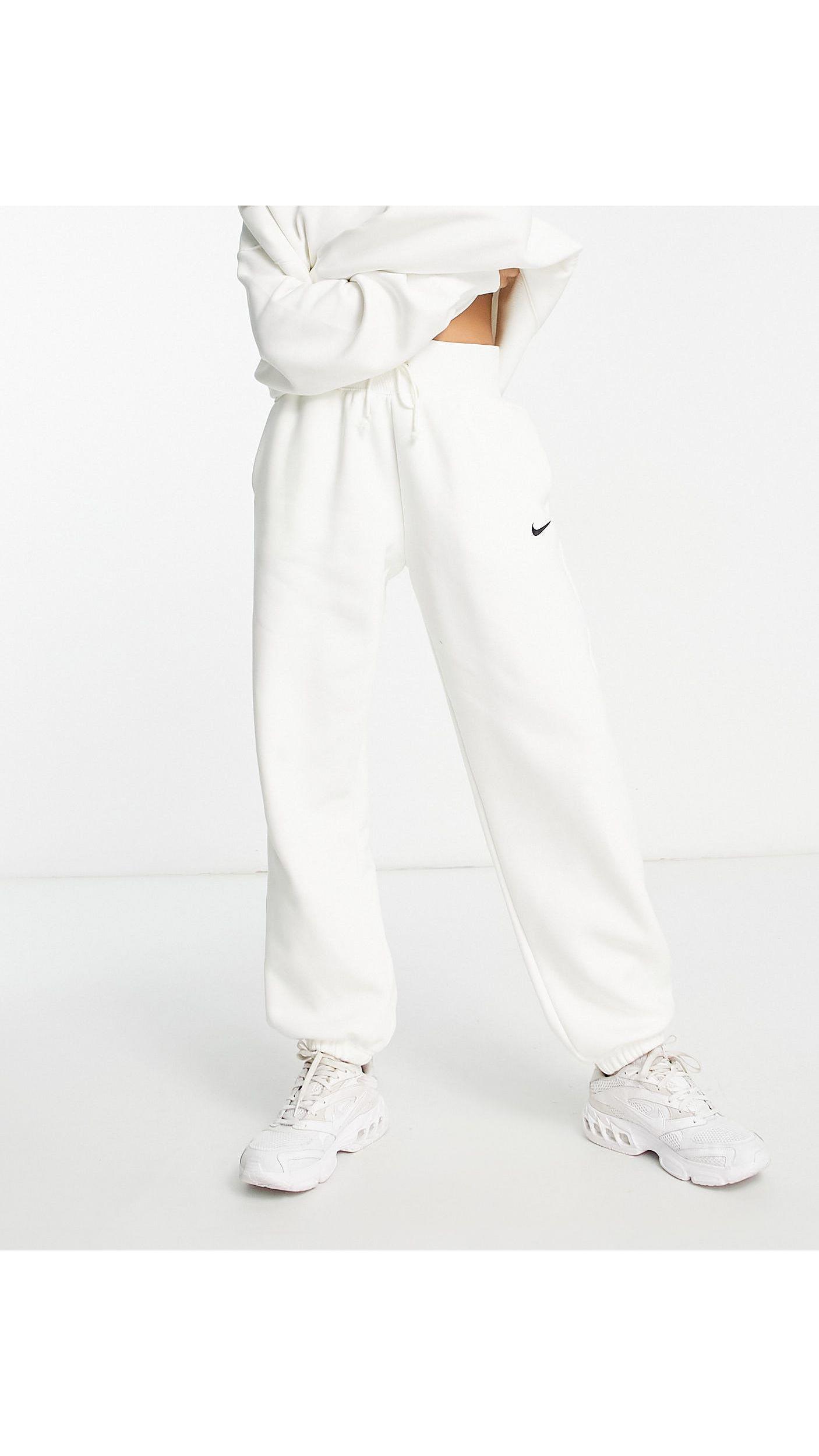 Nike Mini Swoosh Oversized High Rise joggers in White | Lyst