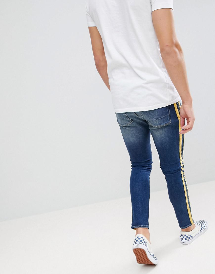 mens jeans with yellow stripe