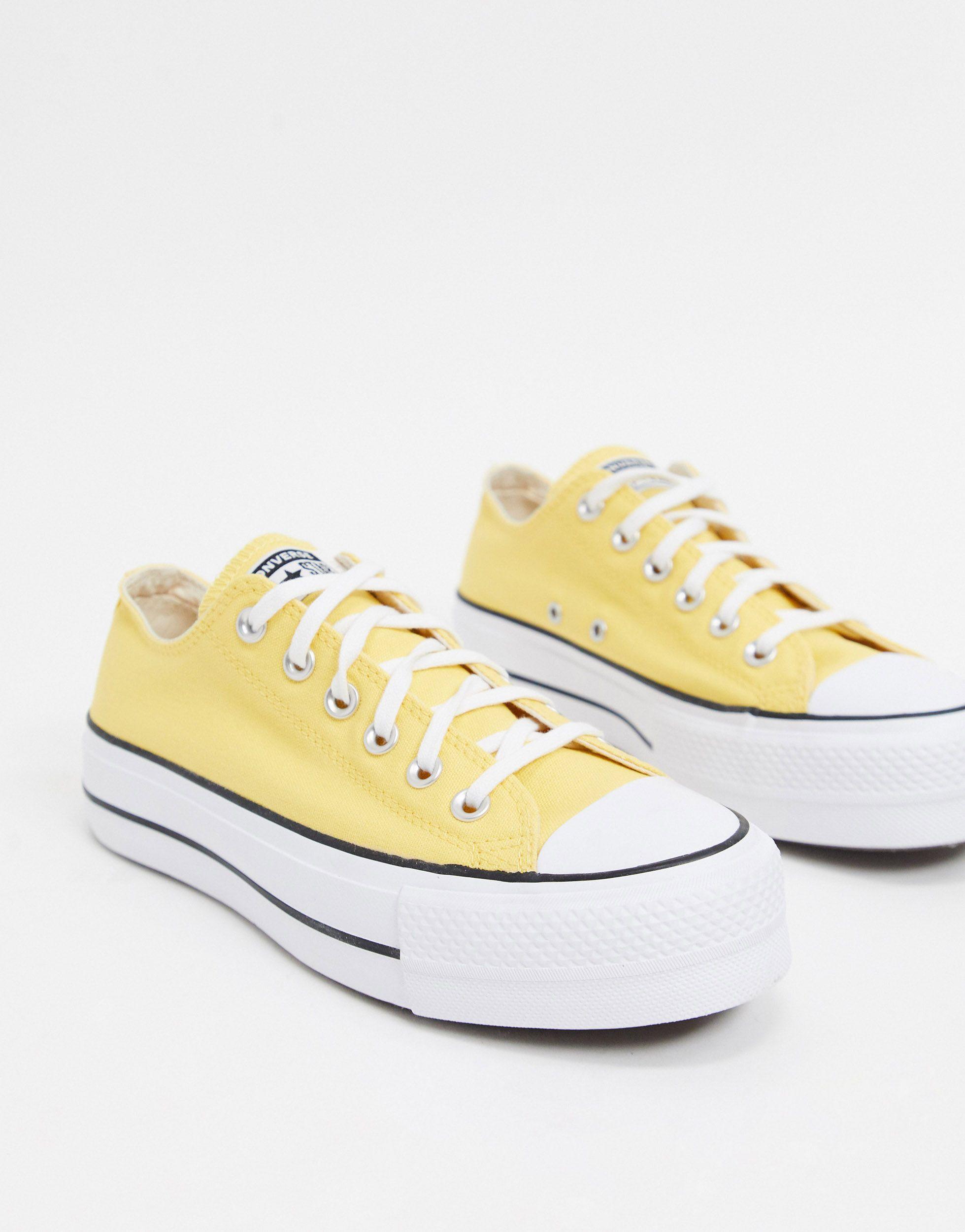 yellow all star clean lift platform trainers