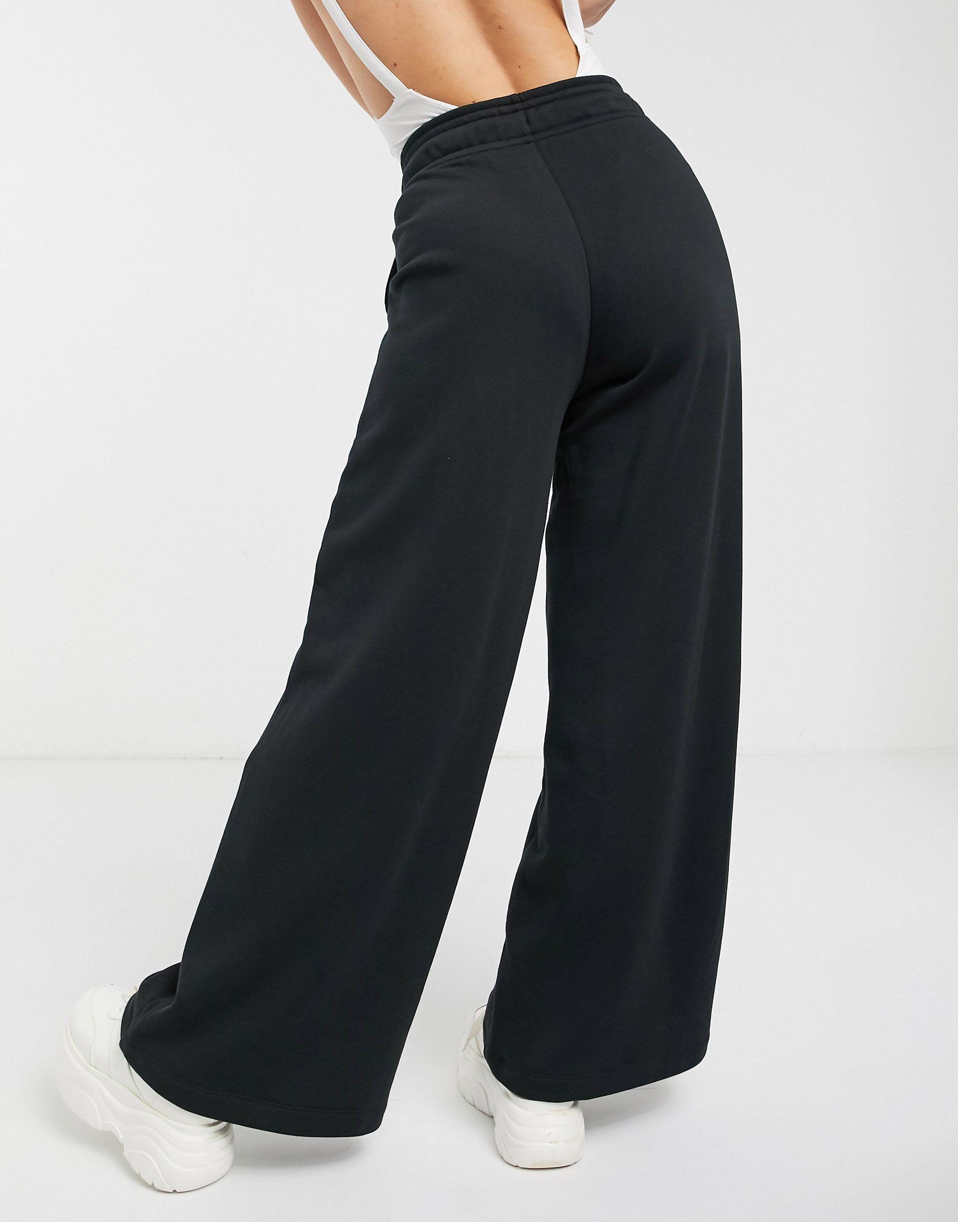 Joggers neri a vita alta con fondo ampioNike in Cotone di colore Nero | Lyst