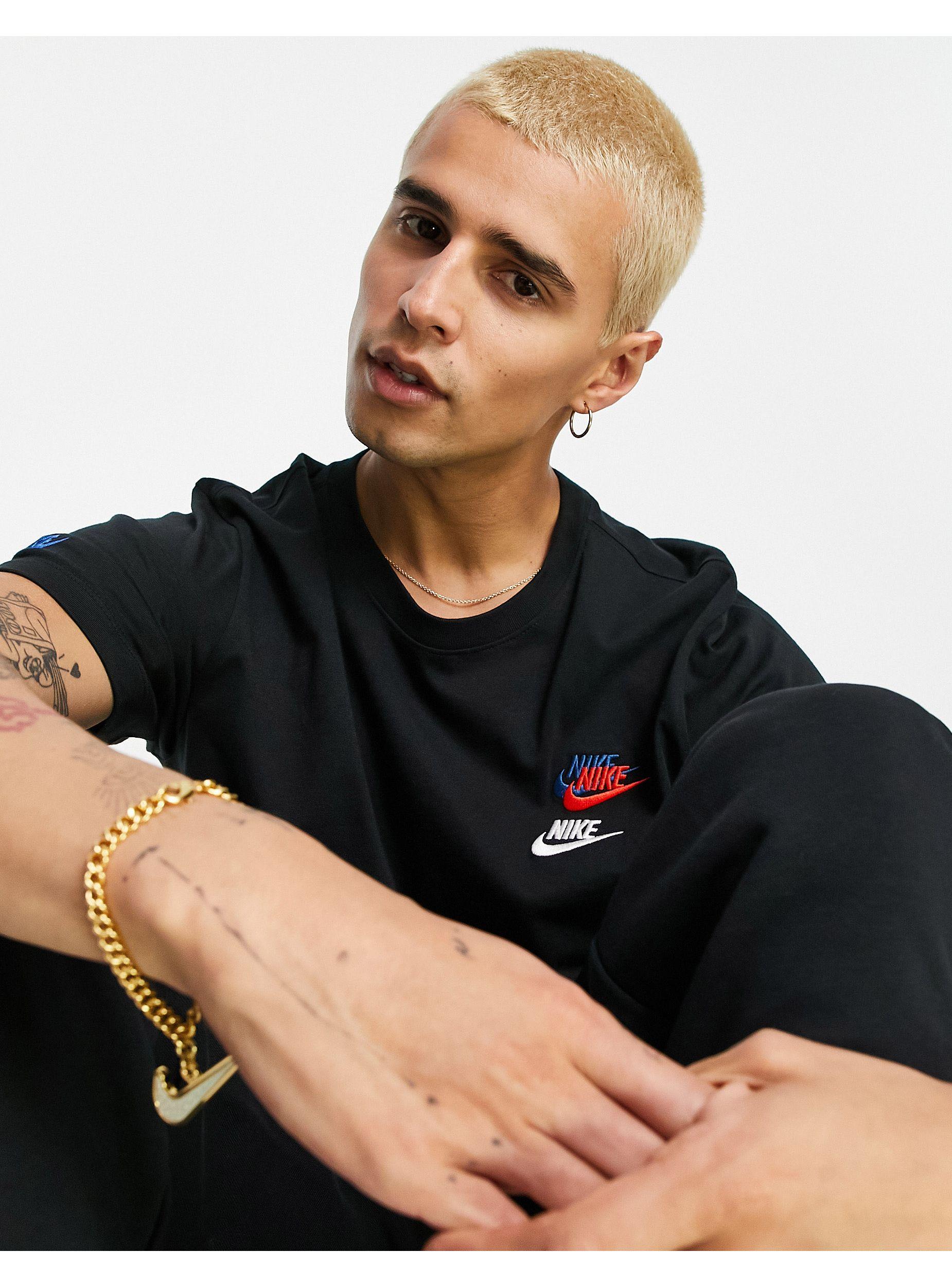 Nike Essentials+ Multi Logo T-shirt in 