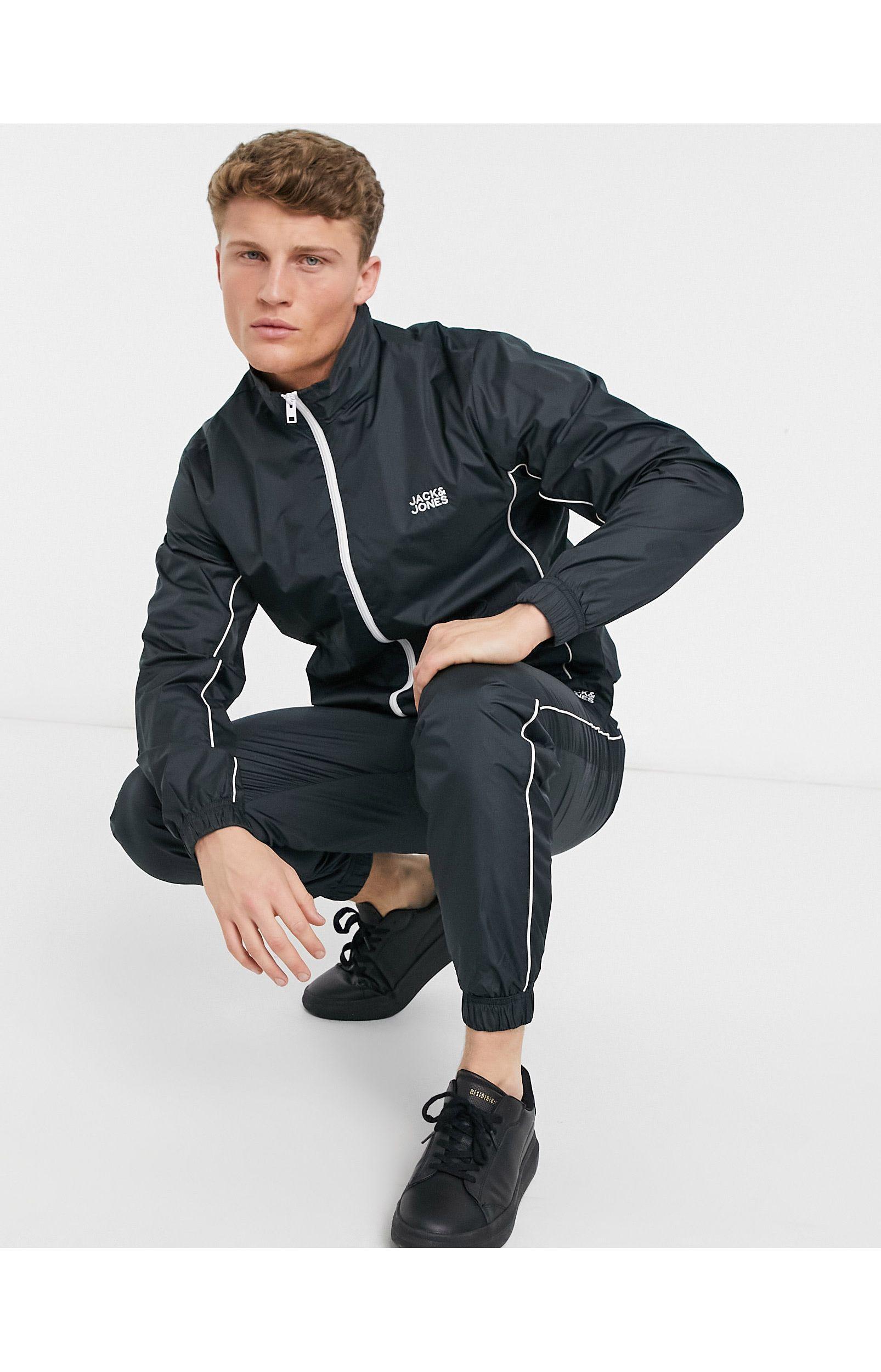 Intelligence - Tuta sportiva nera con profili a contrastoJack \u0026 Jones in  Materiale sintetico da Uomo colore Nero | Lyst